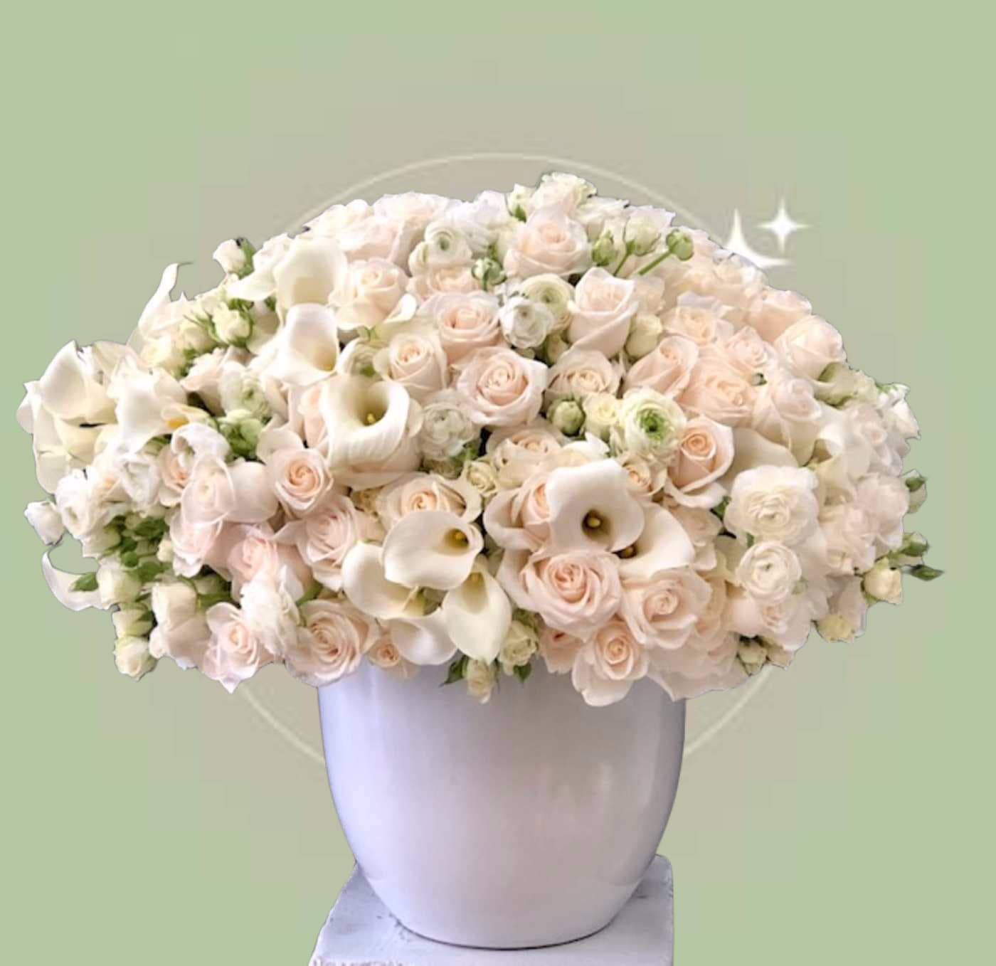 Simply Pure Simply Pure - This classic beauty with its timeless composition is lush with a mix of white and ivory blooms. Touches of white florals for pure soft elegance is accented with a mix of delicate white blooms. The element of white calla lilies throughout symbolizes class and grace. Some florals are seasonal, if particular flower will not be available due to season, we will substitute for similar flower, composition, color pallet and value of the arrangements as closely as possible. All effort to create a floral arrangement as close to the photo shown, the actual arrangement may vary slightly in its appearance from the photo shown. If you have any questions about your order, we welcome you to call us in or email
