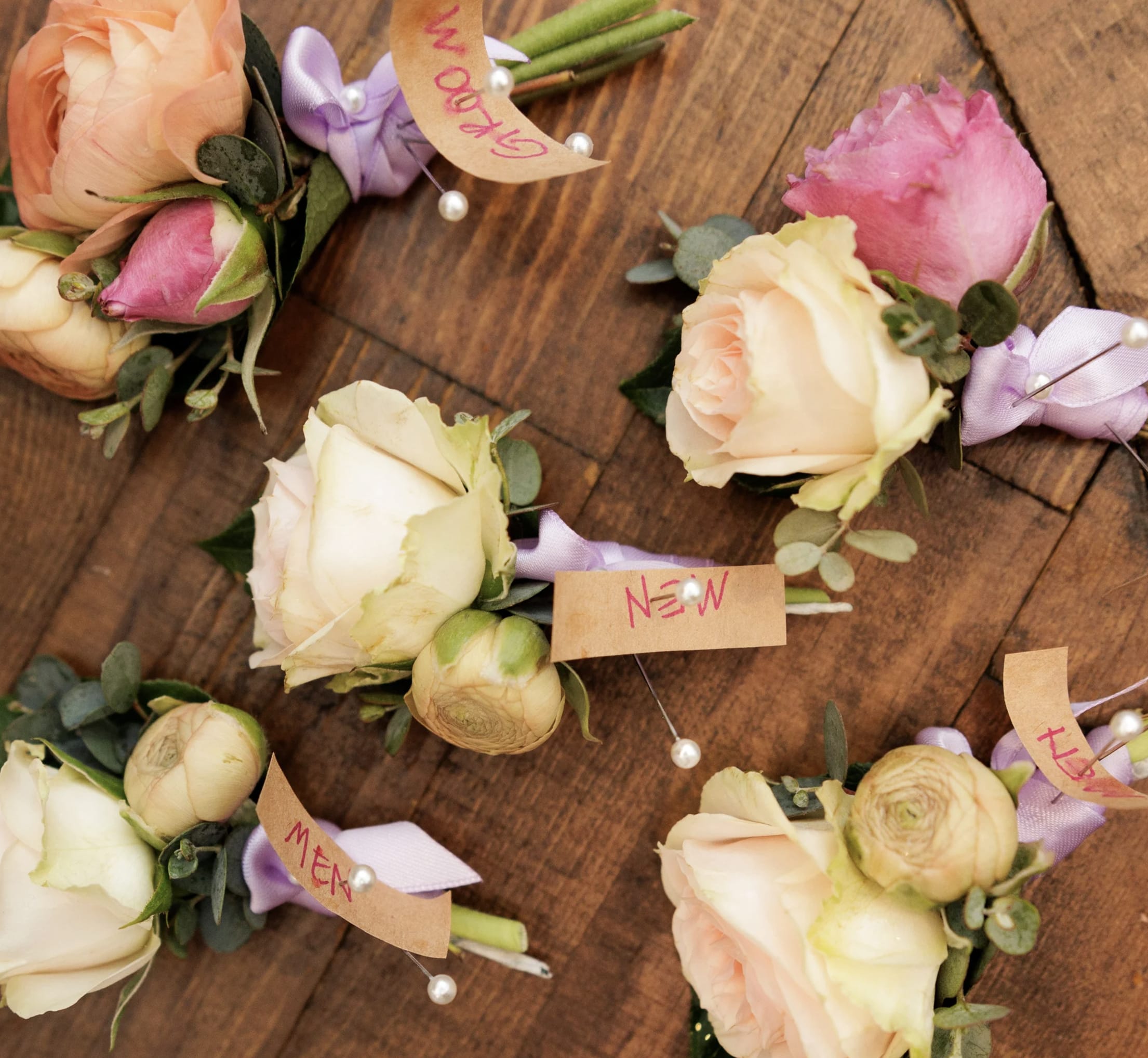 Boutonniere - Add a touch of timeless elegance to your special occasion with a handcrafted boutonniere, featuring a perfectly balanced arrangement of fresh blooms and greenery. Designed to complement any suit or tuxedo, this petite floral piece adds a refined, personal touch to weddings, proms, or formal events.  