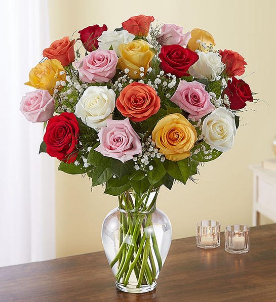 Colorful Long Stem Assorted Roses Colorful Long Stem Assorted Roses - All-around arrangement with 24 long stem multicolor roses; accented with baby’s breath and assorted greenery, measures approximately 23"H x 18"L