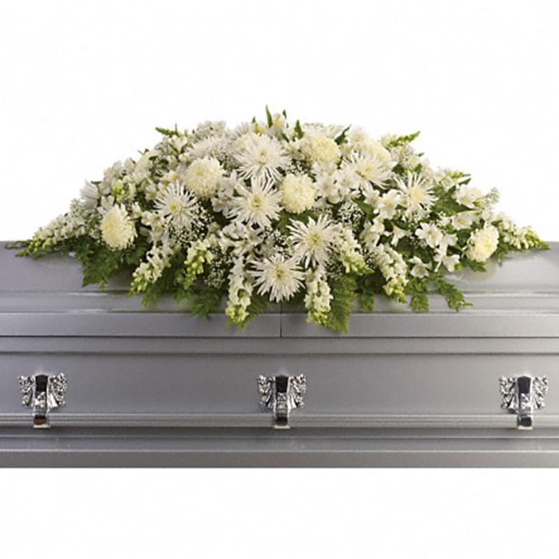 Enduring Light Casket Spray [T264-3A] - The purity of this all-white casket spray creates an aura of serenity and peace - a beautifully memorable final farewell to a lost loved one.  The elegant arrangement includes white alstroemeria, white snapdragons, white chrysanthemums, white spider chrysanthemums and million star gypsophila, accented with assorted greenery.  Approximately 54&quot; W x 23&quot; H  Orientation: N/A  As Shown : T264-3A