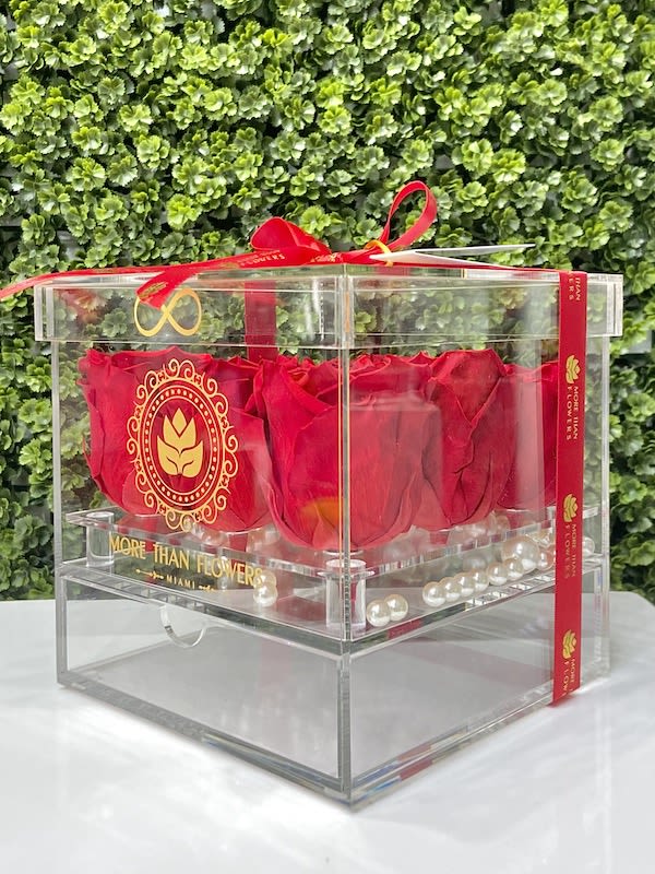 Eternal Roses Acrylic Box (9 Roses) - Red - Eternal Roses Acrylic Box (9 Roses): We stopped the clock for our preserved roses to experience our Eternal Deluxe Collection timelessly. 9 preserved roses decorated in our signature deluxe clear acrylic boxes and completed with a bow and a personalized card message, trendy and fancy. Roses that Last 3 years. *Avoid direct sunlight, dust, water or excessive heat. *Available for Nationwide Shipping (5-7 days shipping time)