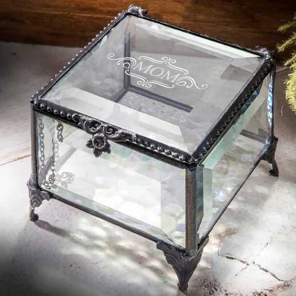 HER- Glass Keepsake Box- Mom HER- Glass Keepsake Box- Mom - J Devlin Collection, Stained Glass Jewelry Box -carefully handcrafted by skilled artisans using a copper foil and solder technique developed by Louis Comfort Tiffany in the late 1800’s. This age-old art form combined with 21st century designs creates the perfect combination for unique home décor. 3-1/4" x 3-1/2" x 2" Buff with dry cloth as needed