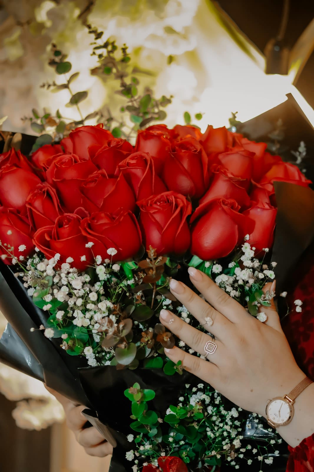 Glamorous Red Rose Luxury Bouquet - Make a bold and romantic statement with the Glamorous Red Rose Luxury Bouquet. Featuring a lavish collection of vibrant red roses, accented with delicate white baby's breath and lush greenery, this bouquet is the epitome of elegance and charm. Wrapped in sleek black paper and tied with a sophisticated ribbon, this design radiates luxury and sophistication.  Perfect for special occasions such as anniversaries, Valentine's Day, or a grand romantic gesture, this bouquet ensures a lasting impression.  Features:  Premium red roses in full bloom  Accented with delicate baby's breath and rich greenery  Wrapped in elegant black paper for a modern and stylish look  Perfect for romantic occasions or grand celebrations  Let the Glamorous Red Rose Luxury Bouquet express your love and appreciation with its stunning and luxurious design. Perfect for making unforgettable memories!