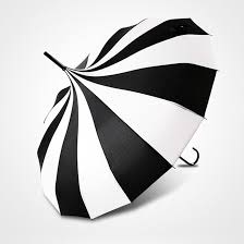Boutique Classic Pagoda Umbrella Black and Cream Boutique Classic Pagoda Umbrella Black and Cream - This beautiful black and cream Boutique Classic Pagoda umbrella will be a definite head turner with the striking colors! Everyone will comment how stunning it is. This beautiful boutique style umbrella can be used as both an umbrella during the Rain and a parasol during sunshine. Whatever the occasion this umbrella will brighten up your day. This is a walking stick length with an elegant slim line shaft with a black tip at the top (the ferrule). It also features a delicate slimline soft rubber black handle. It comes with a black tassel which gives it that extra touch and finish. With an open diameter of 95cm this more than covers you to protect you in the rain.