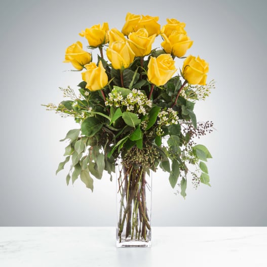 Felicitations by BloomNation™ - Yellow roses are a great option to send a non-romantic love. Send a dozen yellow roses to your friend or family member to brighten up their space and celebrate them! Yellow roses are a good gift for graduations, birthdays, or celebrating an accomplishment like a new job.  Approximate Dimensions: 18&quot;D x 25&quot;H