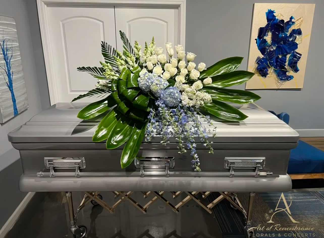 Bundle of Joy by Art of Remembrance Bundle of Joy by Art of Remembrance - This display of roses, hydrangeas and stock are designed to provide a feeling of inner unexplained joy.