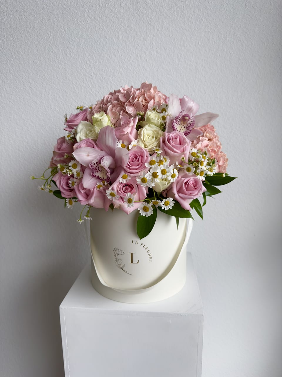 Chamomiles and Roses  -  This romantic arrangement includes roses, chamomiles and greens.  Perfect for any occasion. You can choose any color of the box.  Arrangement includes:  SMALL BOX Custom greeting card