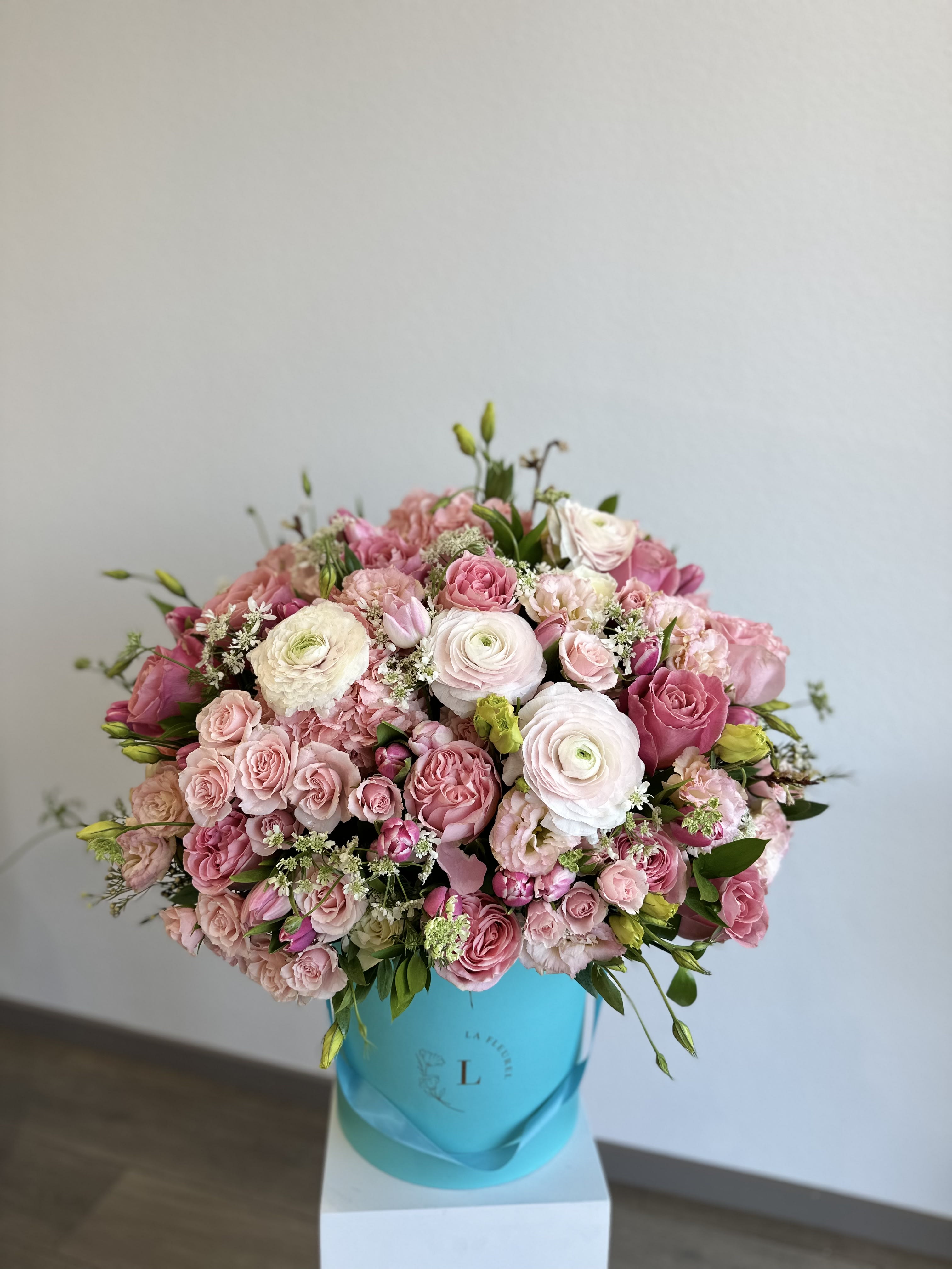 Charlotte's Charm Charlotte's Charm - This beautiful arrangement is filled with pink roses, hydrangeas, ranunculuses and greens to deliver your special message to your special someone. Perfect for any occasion. You can choose any color of the box. Arrangement includes: Medium box Custom greeting card