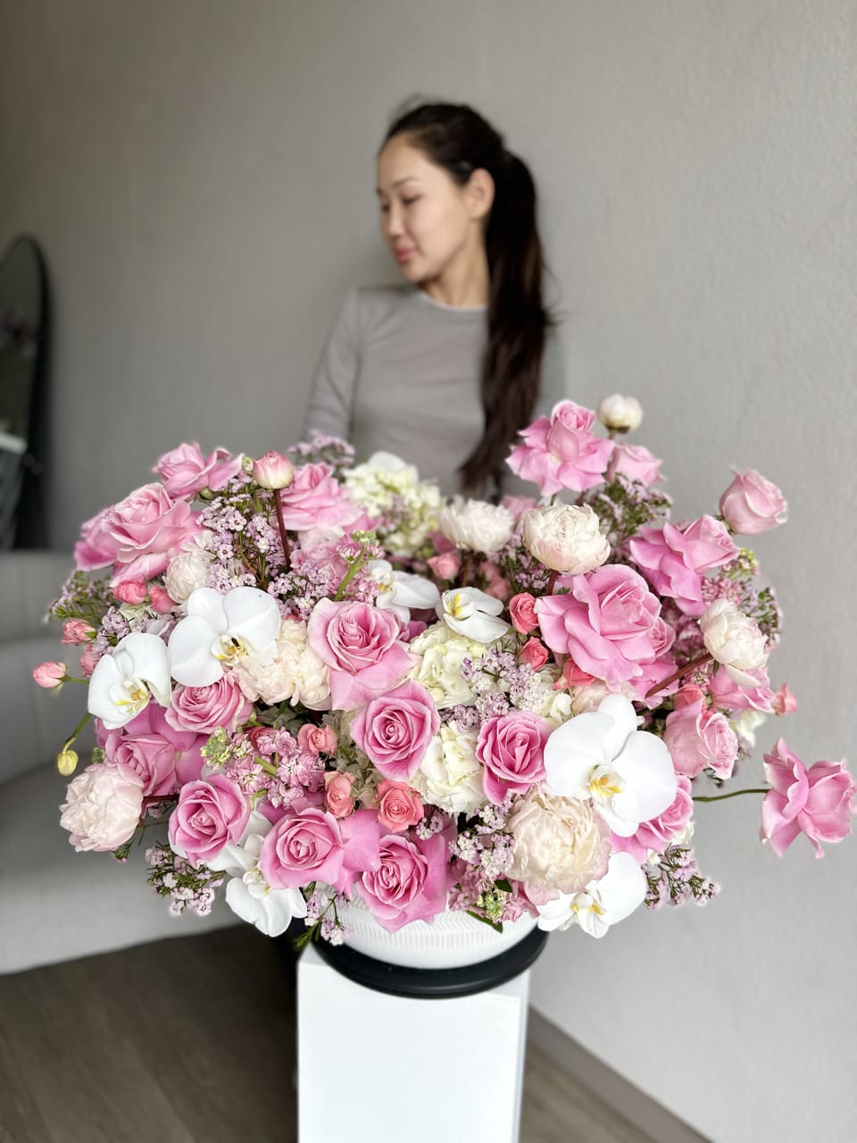 Grand Pink Rose Symphony - An opulent showcase of elegance, the Grand Pink Rose Symphony is a lavish arrangement featuring a cascade of exquisite pink roses. This floral masterpiece captivates with its regal beauty, making it the perfect centerpiece for special occasions. The abundance of blooms creates a visual symphony, transforming any space into a realm of timeless romance and sophistication.
