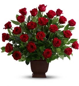  Teleflora's Rose Tribute  - As true as the love symbolized by a red, red rose are the heartfelt memories and deep feelings embraced with this classic and elegant expression of tribute.  Two dozen red roses, accented by salal, are presented in an exclusive Noble Heritage Urn.  Approximately 27&quot; W x 26&quot; H  Orientation: One-Sided