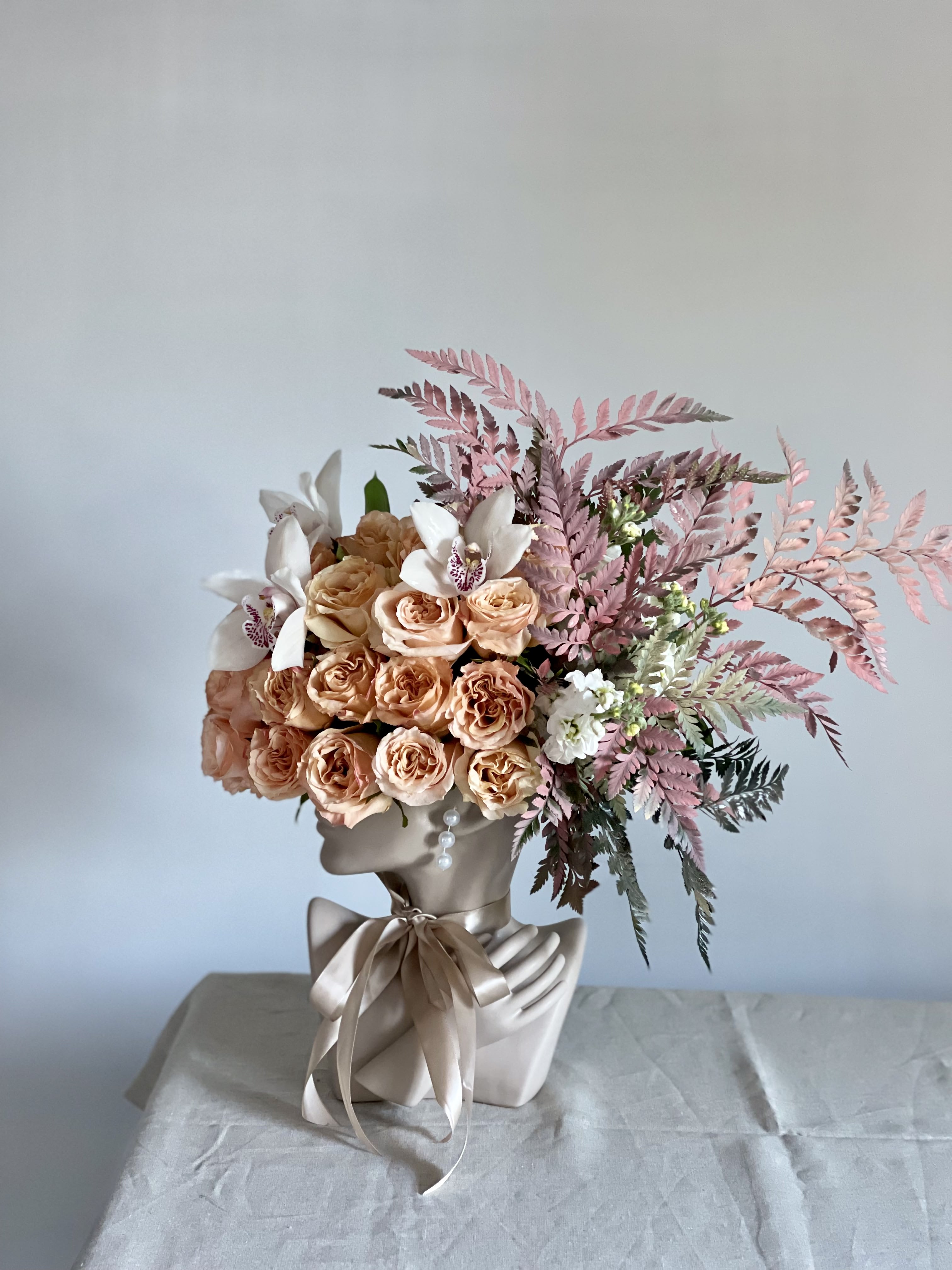 Lady Beauty - This beautiful arrangement is filled with peach roses, orchids and greens to deliver your special message to your special someone.  Perfect for any occasion. You can choose different color of the vase  Arrangement includes: roses  Vase Custom greeting card