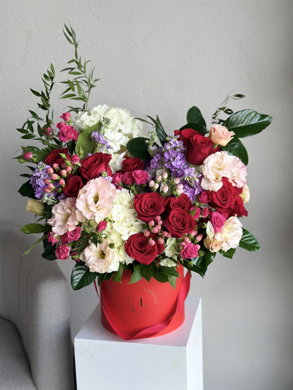 Scarlet Rose Box - An embodiment of passion and elegance, our Scarlet Rose Box is a striking arrangement of deep crimson roses nestled in a captivating red box. This bold yet refined ensemble speaks volumes of love, making it a perfect gesture for special moments or as a statement piece in any space.