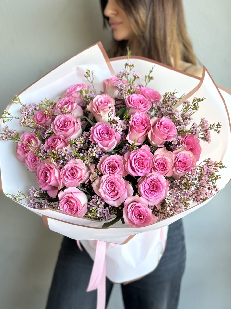 Sweet Unique Roses bouquet - An enchanting hand-held bouquet, featuring 25 Sweet Unique Pink Roses, each petal whispering tales of grace and tenderness. Meticulously arranged, this captivating display exudes timeless elegance and charm, perfect for infusing any occasion with romance and beauty.