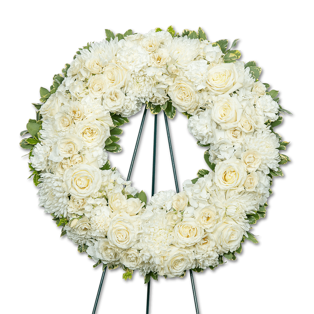 Pure Serenity Wreath Pure Serenity Wreath - The Pure Serenity Wreath is a timeless and heartfelt tribute to honor the memory of a loved one. Crafted with care and compassion, this elegant standing wreath captures the essence of peace and offers solace during times of grief. This floral wreath stands as a symbol of everlasting love and peaceful remembrance. It features a delicate blend of roses, spray roses, and premium foliage. Each element of the Pure Serenity Wreath is thoughtfully arranged by our floral designer and serves'as a comforting presence during the memorial service or funeral.