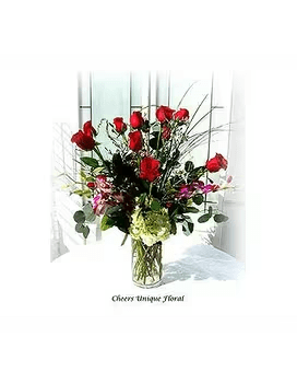 Forever Romance - Red roses, hydrangeas, orchids and with assorted greenary &amp; filler flowers are arranged in a clear glass vase.