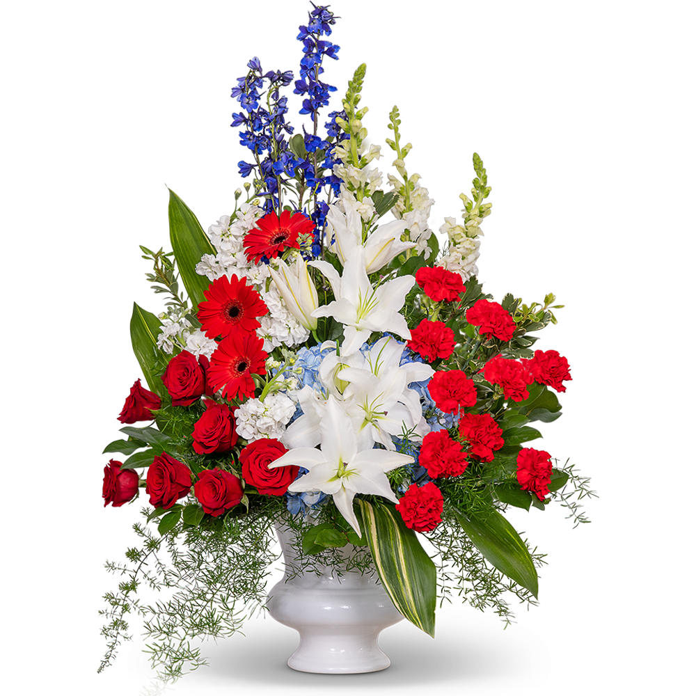Stars and Stripes Forever Urn - Honor the spirit of patriotism and pay tribute to a life filled with an unwavering love for country with our magnificent Stars and Stripes Forever Urn. This stunning flower arrangement captures the essence of loyalty, bravery, and steadfast devotion. In a striking red, white, and blue color scheme, this floral masterpiece features radiant roses, carnations, delphinium, hydrangea, stock, snapdragons, lilies, and gerbera daisies intertwined with lush foliage to create a breathtaking display of patriotic reverence. Their harmonious blend represents the diverse tapestry of a life lived with dedication and love for one's nation.