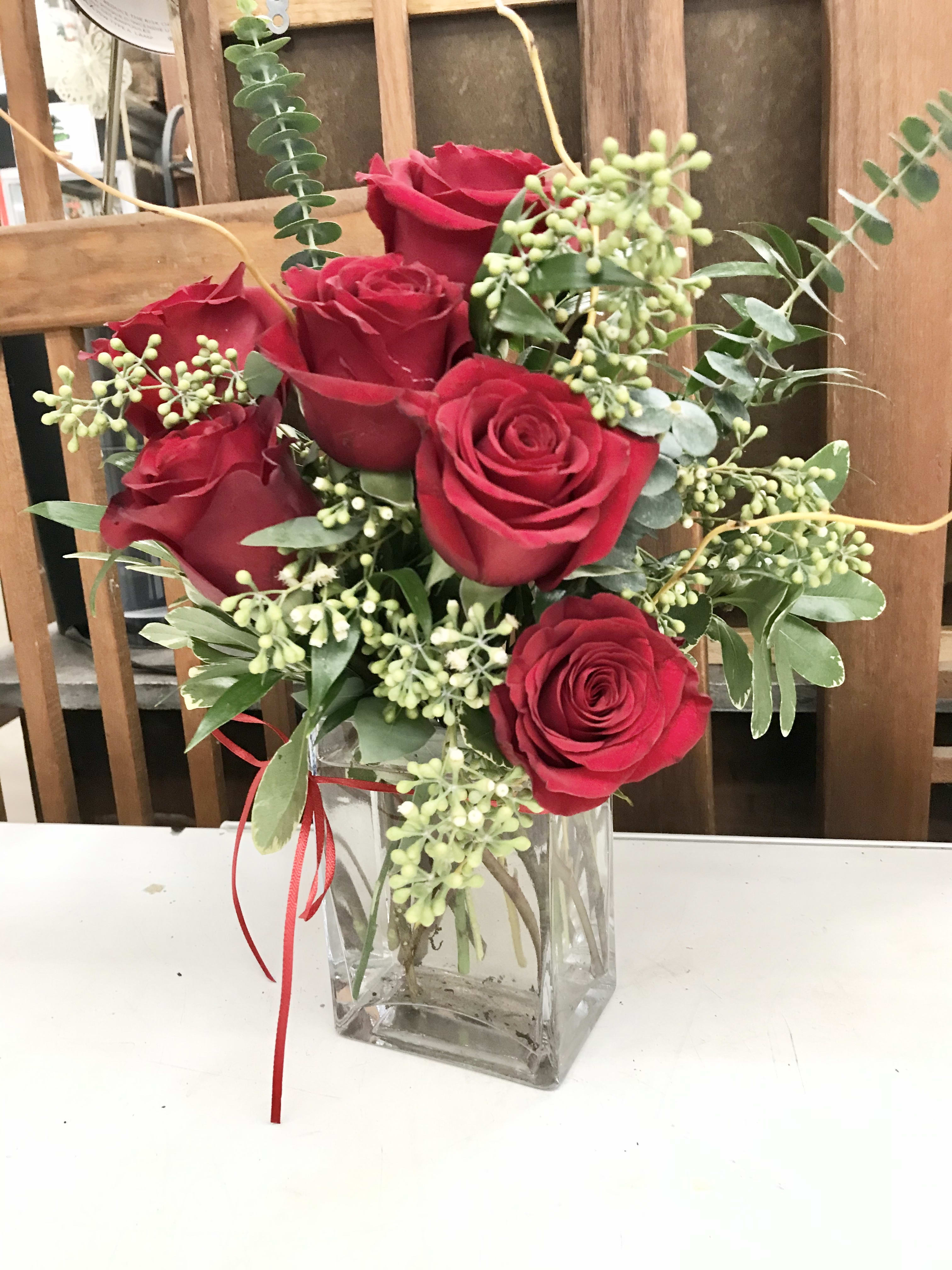 A Little Bit of Love (6 Red Roses) - A half dozen red roses and beautiful greens.