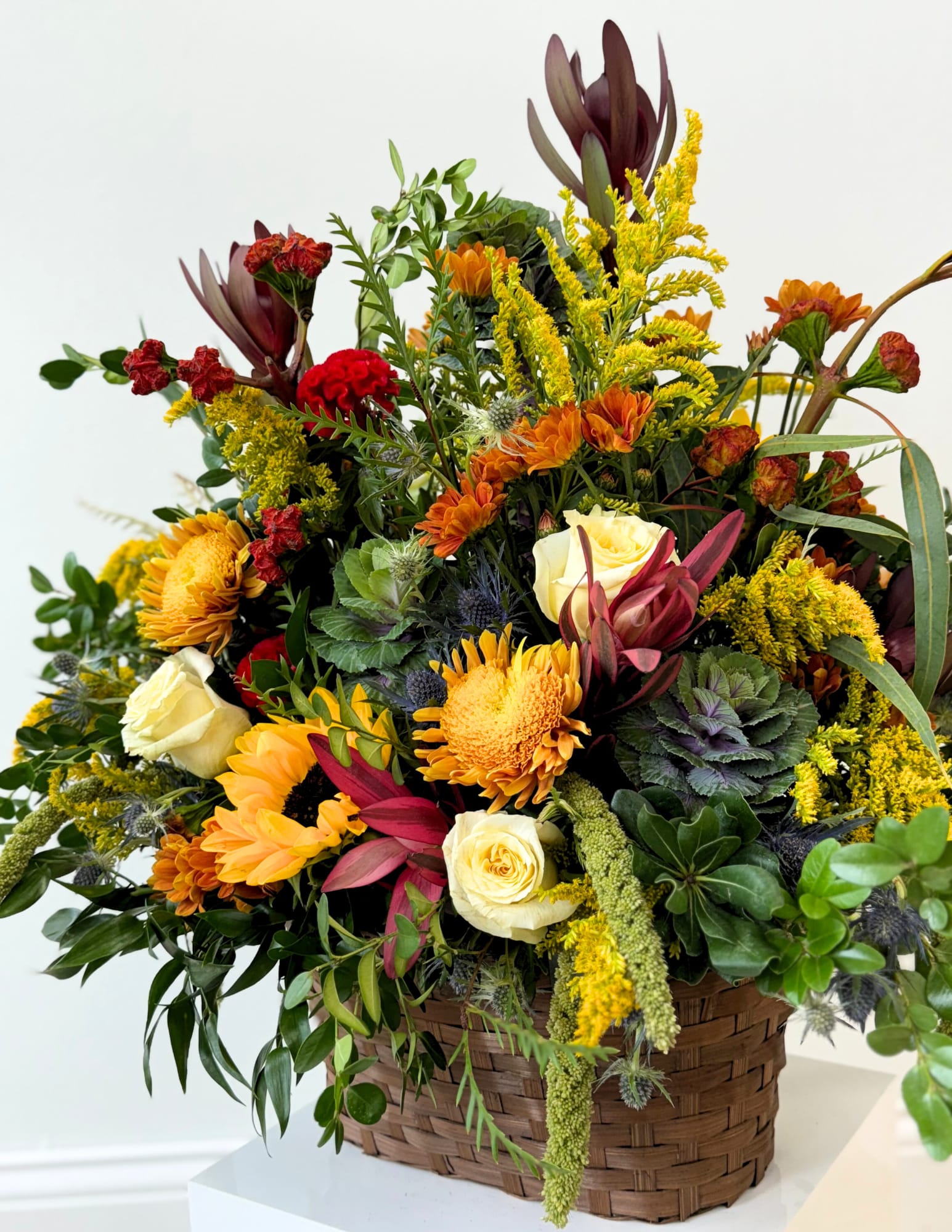 GARDEN SYMPATHY BASKET - A garden sympathy basket offers a serene blend of lush greenery and soft blooms, symbolizing peace, comfort, and heartfelt condolences. 