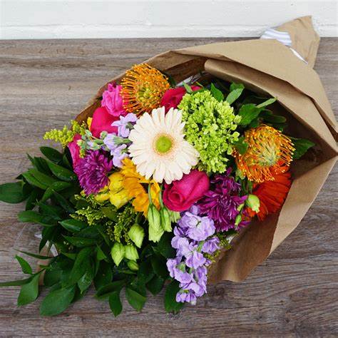 Mixed Floral Market Bouquet - A beautiful mix of seasonal flowers (designer's choice and based on availability) arranged with our signature wrapping, satin ribbon and diamante accent, Available for pickup at the boutique!   A perfect gift for anyone or to brighten your own day!   *The Photograph is an example of a Market Bouquet. The actual product will vary based on seasonal availability. 