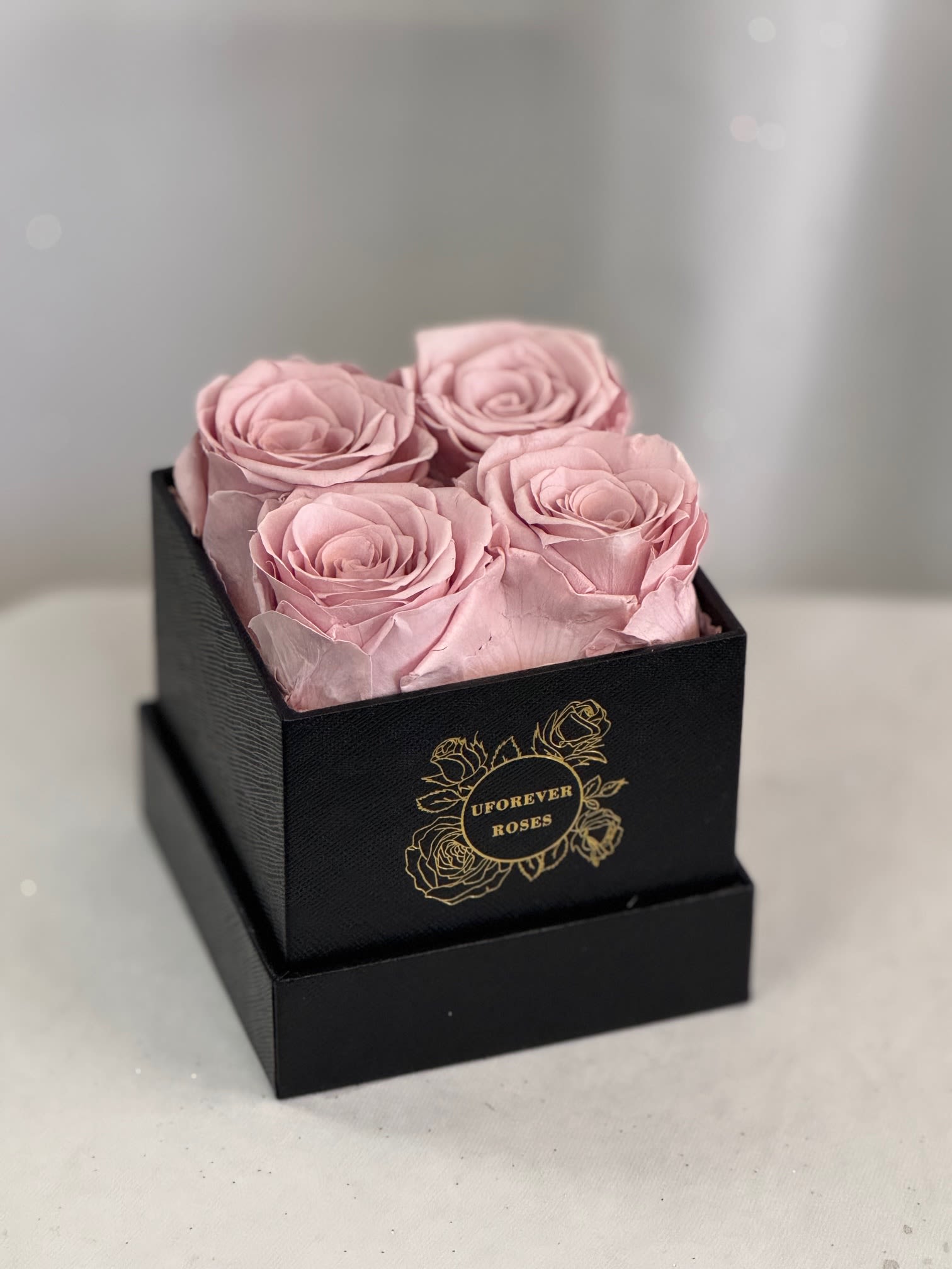 Forever Roses Dusty Pink  - A lasting luxurious gift of roses, that will impress your special someone and bring them joy every time they see them.  A beautifully quality preserved rose chosen at the peak of perfection and then preserved to maintain the original natural beauty of each unique rose. A luxurious and romantic gift of love and adoration to cherish over time. They are preserved and, with proper care, will stay just as beautiful for up to a year or longer.  Care Instructions: Arrangements do not require watering; for maximum beauty, keep away from extreme sunlight &amp; humidity  Roses and hat box arrive inside a decorative gift box with ribbon.  Item dimensions L x W x H: 4 in x 4 in x 5.25 in 4 Dusty Pink Roses 