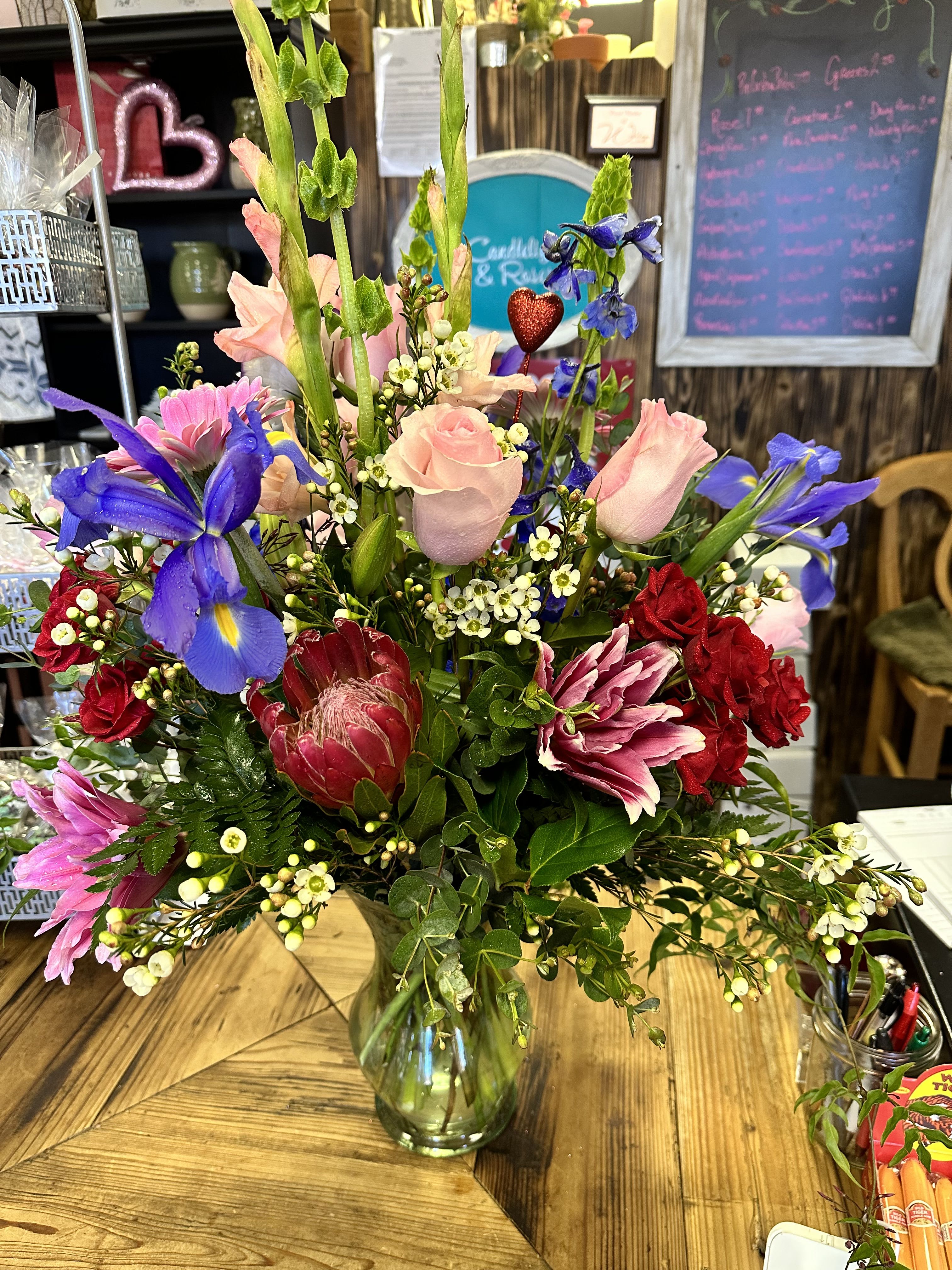PRECIOUS LOVE BOUQUET - UPSCALE BEAUTIFUL MIXED COLORED BLOOMS WITH LILLIES, HYDRANGEA, ROSES, PROTEA, AND IRIS WITH ASSORTED GREENERY AND FILLER FLOWERS