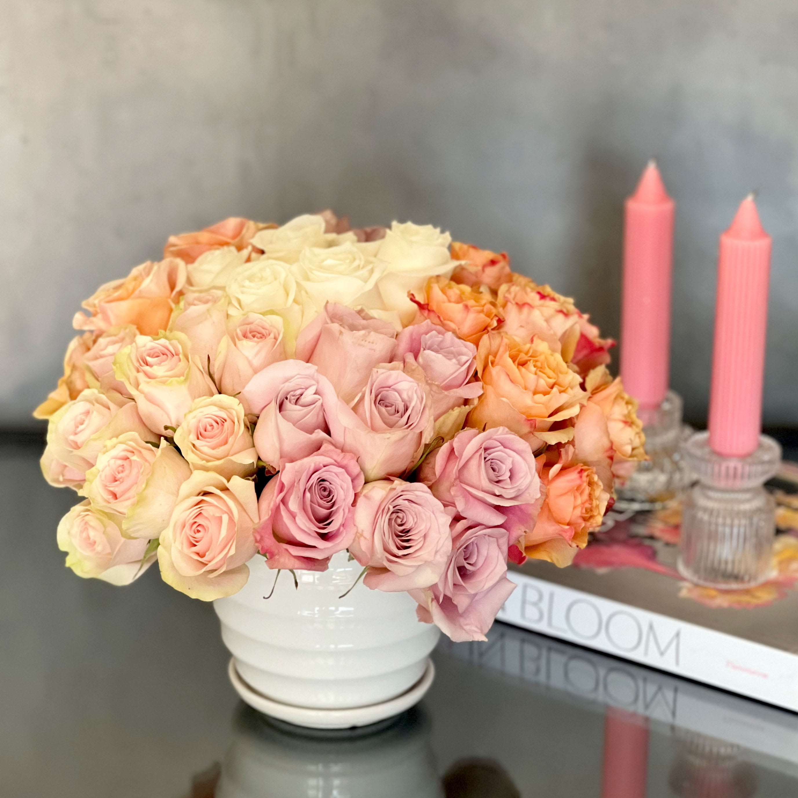 Exquisite Pastels - A sensational floral presentation arranged in a white vase. Luscious pastels featuring 50 Exquisite Pastel roses.  A great choice for that very  special someone or very special occasion.  Approx: 11/15  Deluxe: 75 Roses  Premium: 100 Roses 