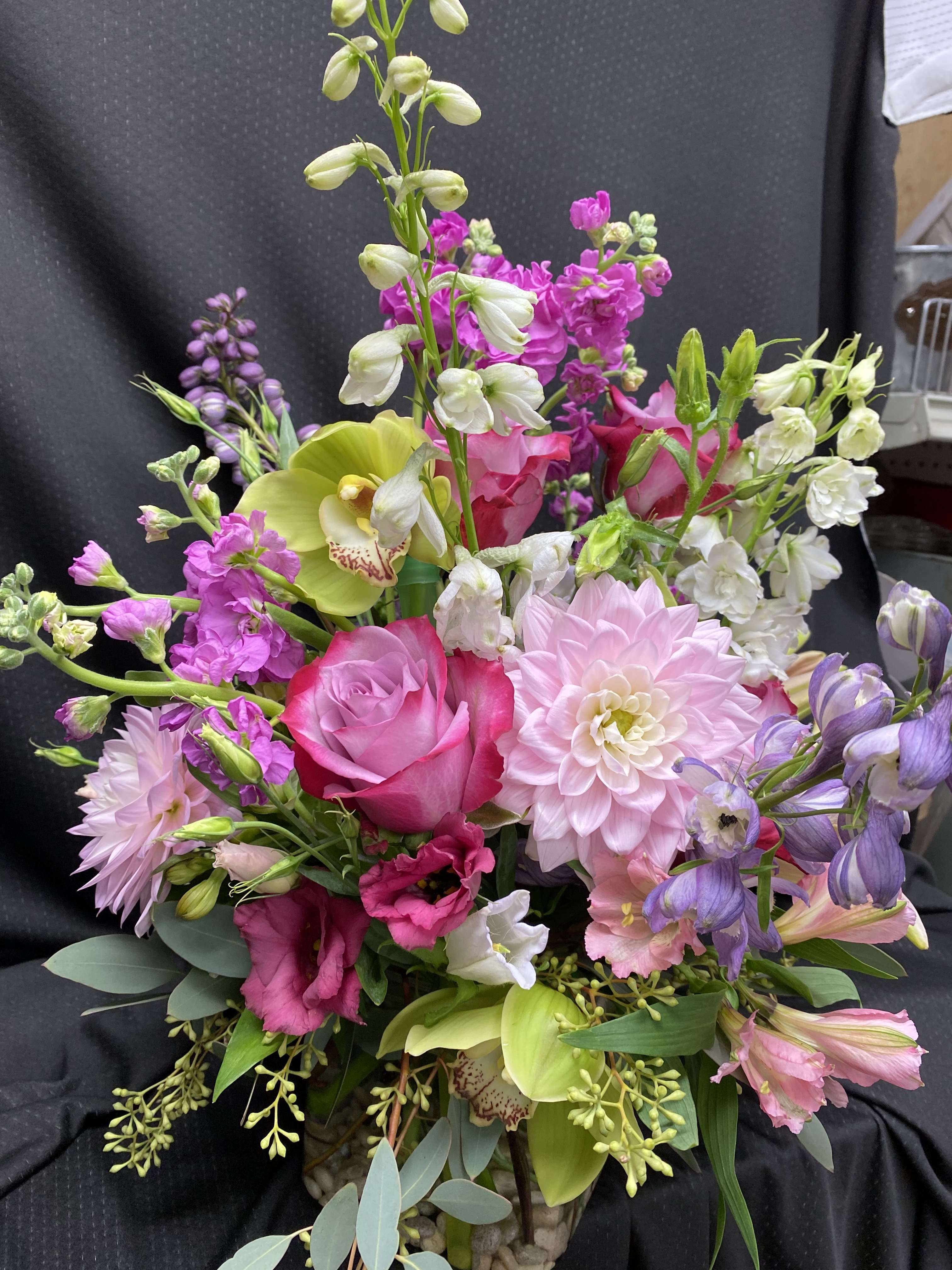 Hidden Dalilah  - Vase arrangement with roses, dahlias, and seasonal flowers. 