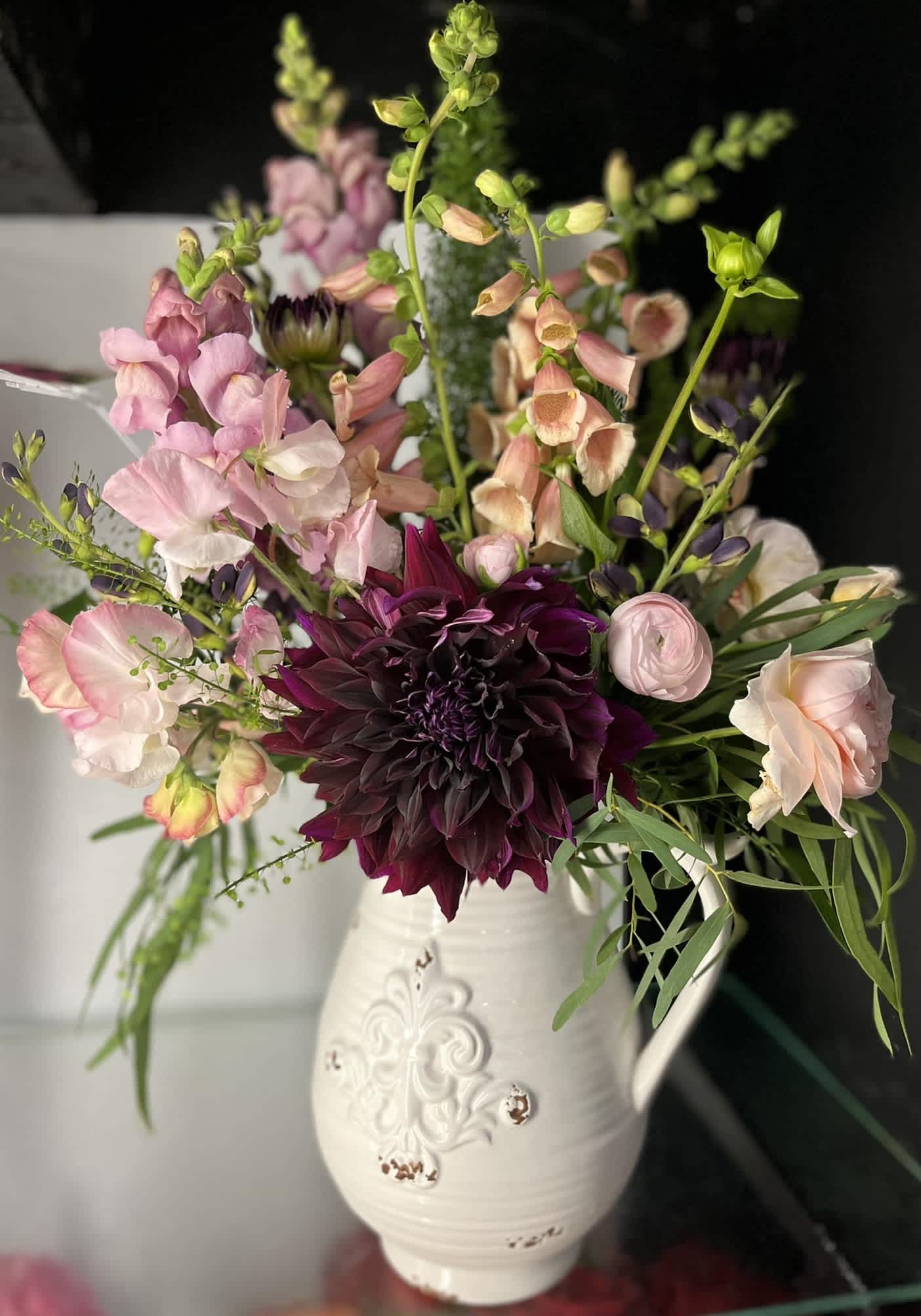 Pop of Red - Vase arrangement with snapdragons, foxglove, dahlias, and ranunculus. 