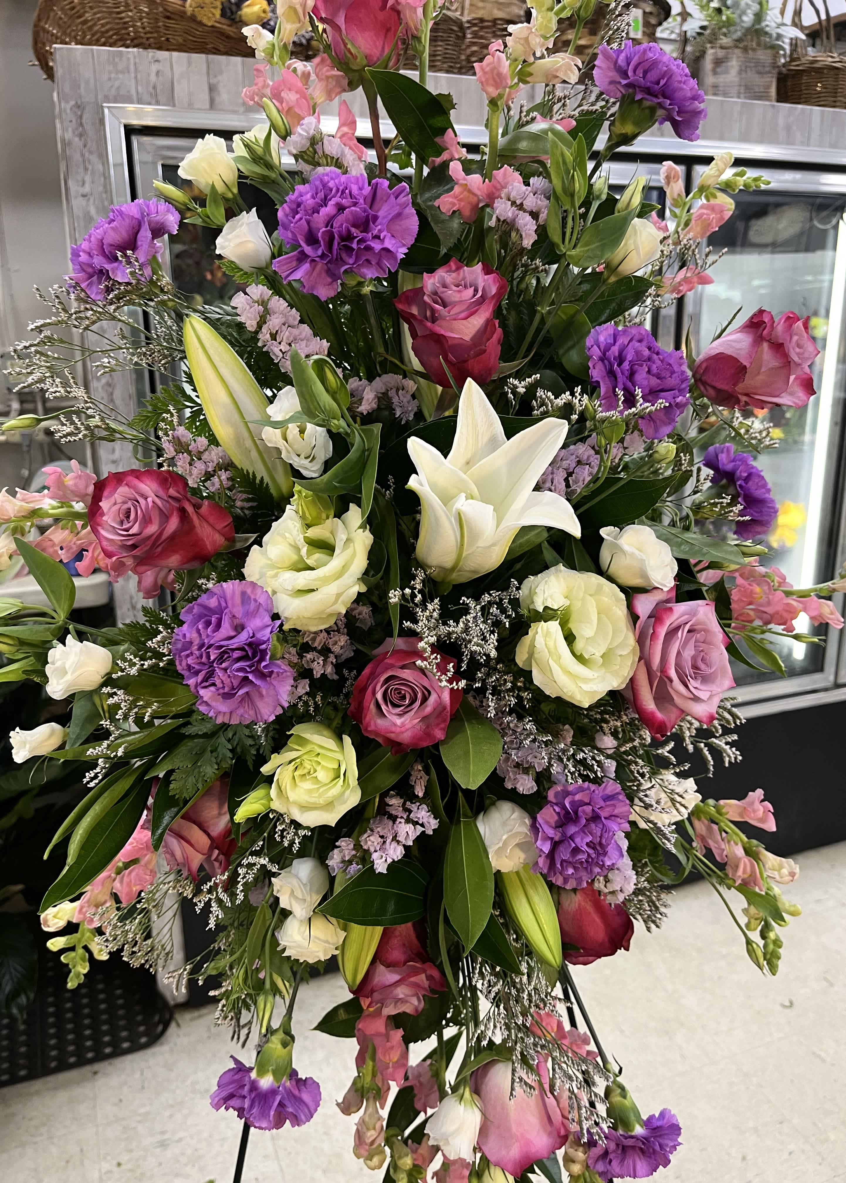 Purple/pink standing spray - Standing Spray with roses, lilies, carnations, and mixed greens. 