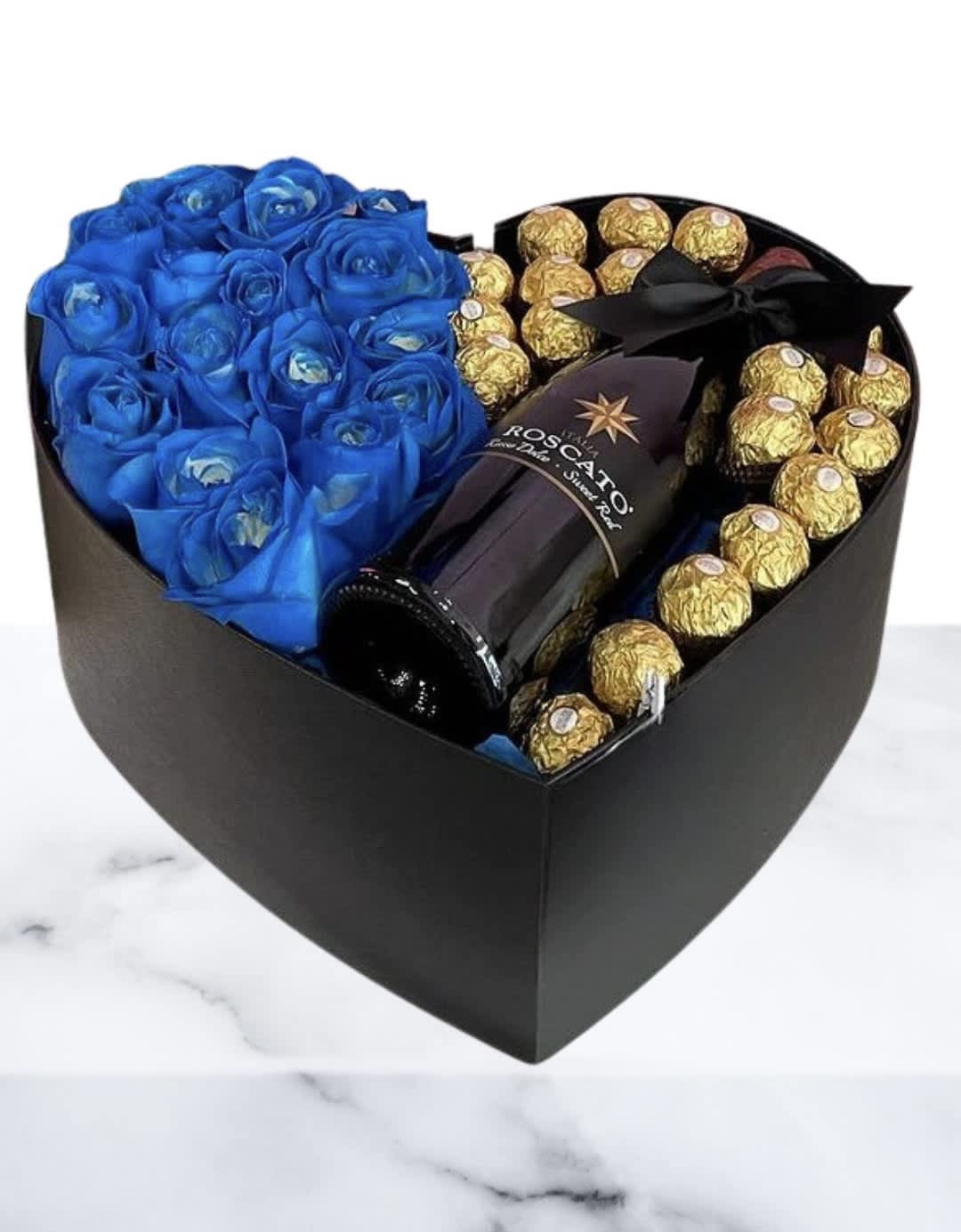 Chocolate Bubbly Blues  - 18 Blue Roses Designed In A Beautiful Heart Shaped Box With Ferrero Chocolates And A Delicious Roscato Rosso Dolce 750 ml Bottle.  Lid &amp; Satin Ribbon.
