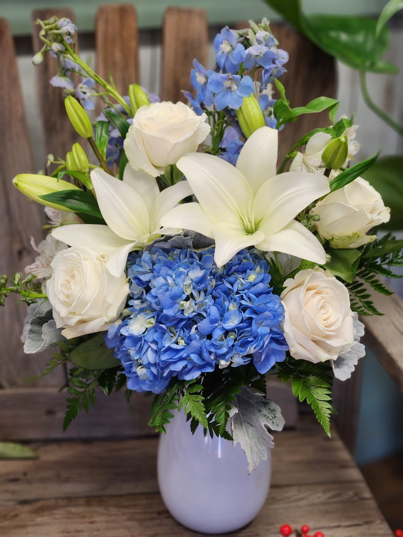 Elegantly Azure Elegantly Azure - This beautiful bouquet features blue hydrangea, white roses rounded out with soft blue delphinium.