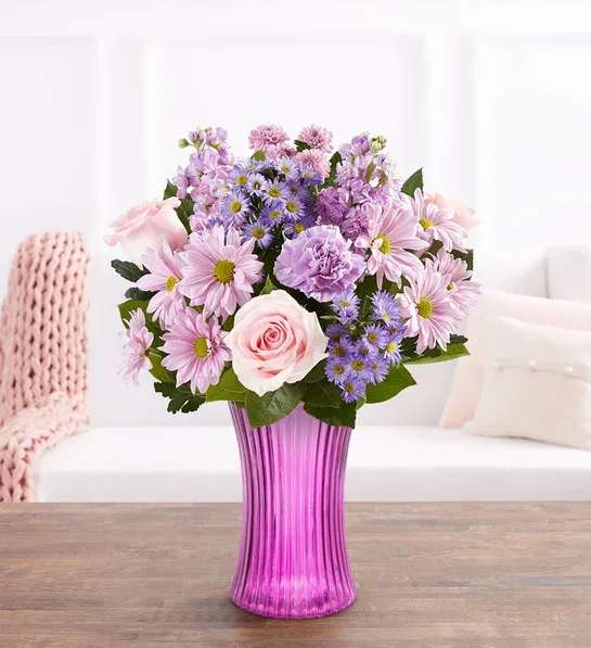 DAYDREAM BOUQUET - EXCLUSIVE Just like a daydream. Our delightful lavender bouquet is gathered with accents of pink and lush greenery in our striking fluted violet gathering vase. Designed in vintage pressed glass with ribbed detailing, it captures the rich beauty of the blooms, along with the thoughtfulness of your sentiment.