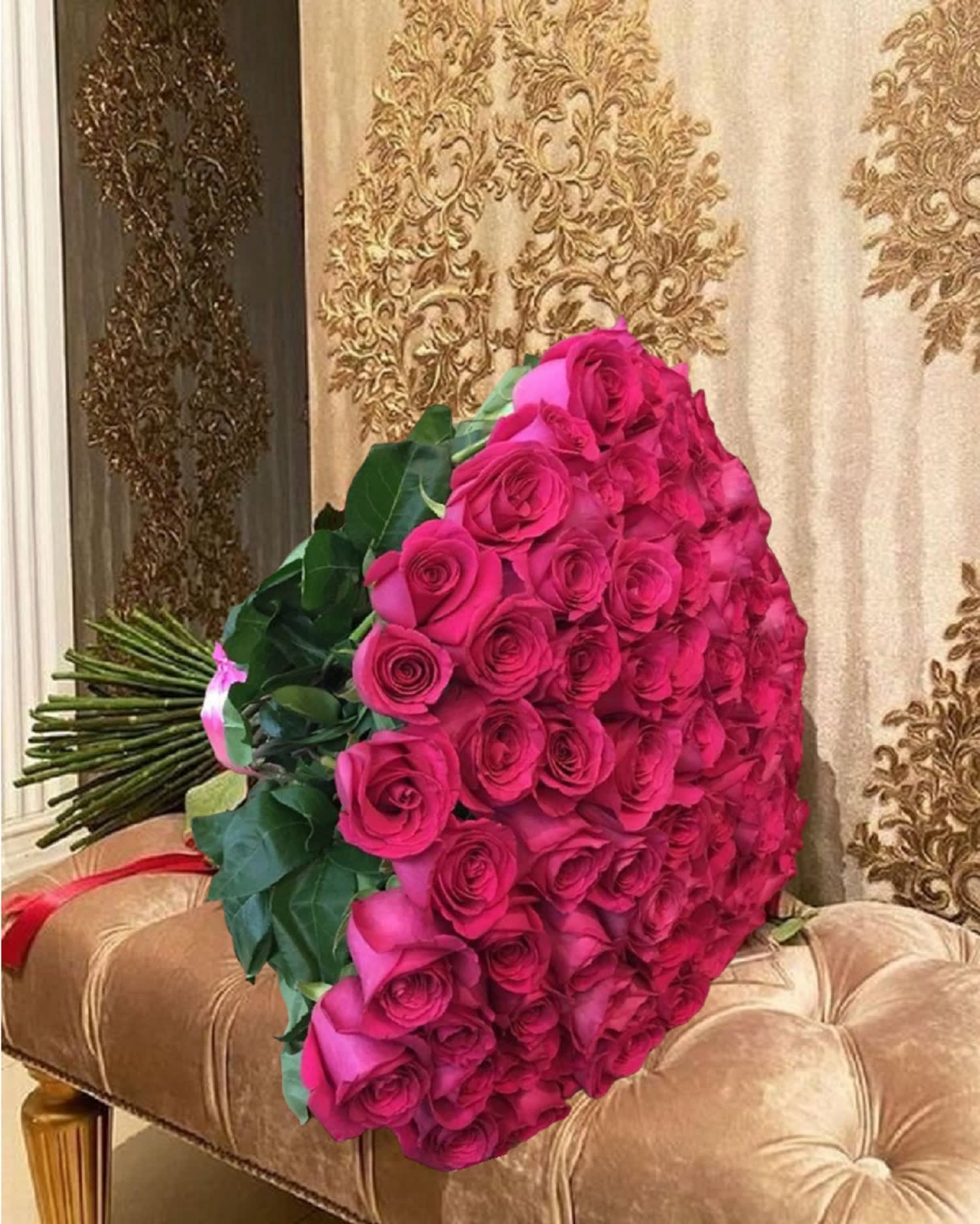 Fuchsia Ramo Buchon - Put a smile on their face - and in their heart - with this Luxury Bouquet! This beautiful gift of roses, and lush greens, spreads happiness wherever it goes. If you want to make a really big impression, surprise them with a delivery to the office. Imagine the oohs and ahhs of their co-workers - and your special someone.  DETAILS This cheerful bouquet includes fuchsia roses, accented with greenery, tied with a satin ribbon at the stems.  VASE NOT INCLUDED Orientation: All-Around Item #NF-147  FLORIST-TO-DOOR Same day flower delivery on most orders placed online by 12 pm or 10 am on weekends PST.  BLOOM DETAILS Fuchsia Roses Greenery  The Standard - 100 ROSES The Deluxe - 150 ROSES The Premium - 200 ROSES   How to place an order? 1. You can place an order directly on this secure website OR 2. You can call in your order by dialing: (323) 262 - 9238 OR 3. You can visit our store (appointment recommended 323.262.9238)  NINFA'S FLOWERS 2405 WHITTIER BLVD. LOS ANGELES, CA. 90023  ATTENTION: *Please note that on busy holidays, Valentine's Day, and Mother's Day, we cannot verify if the recipient received the flowers until the following day. You can verify delivery on the website after 10:00 pm, call 323.262.9238 the following day after 10:00 am, or contact the recipient directly. Thank you for your patience and understanding.