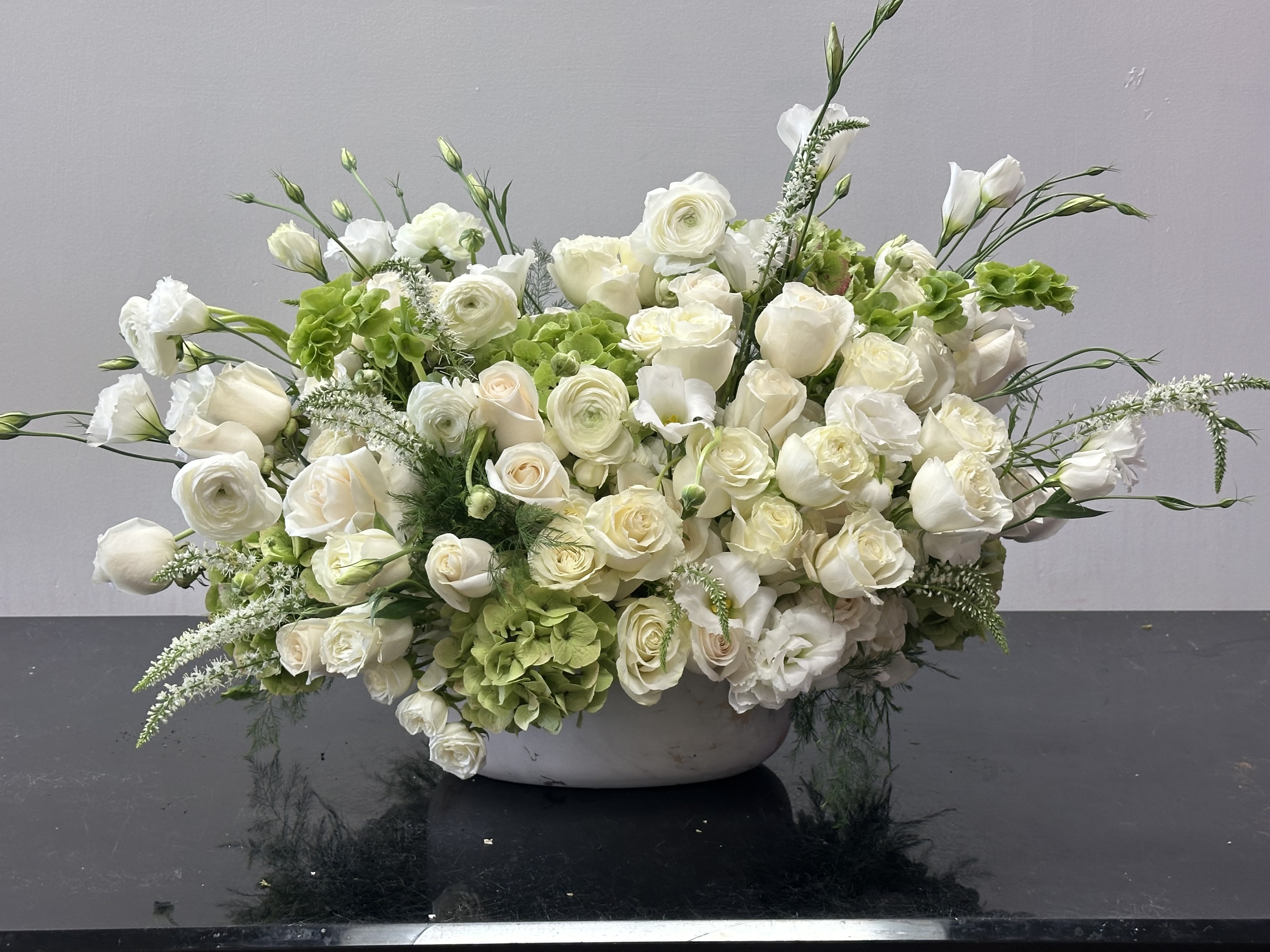 Tuscany Tuscany - This charming Tuscan inspired is pure, soft beauty with white blooms, roses, hydrangeas and verdant greenly paired with beautiful vase enhancing charm and beauty. Some florals are seasonal, if particular flower will not be available due to season, we will substitute for similar flower, composition, color pallet and value of the arrangements as closely as possible. All effort to create a floral arrangement as close to the photo shown, the actual arrangement may vary slightly in its appearance from the photo shown. If you have any questions about your order, we welcome you to call us in or email