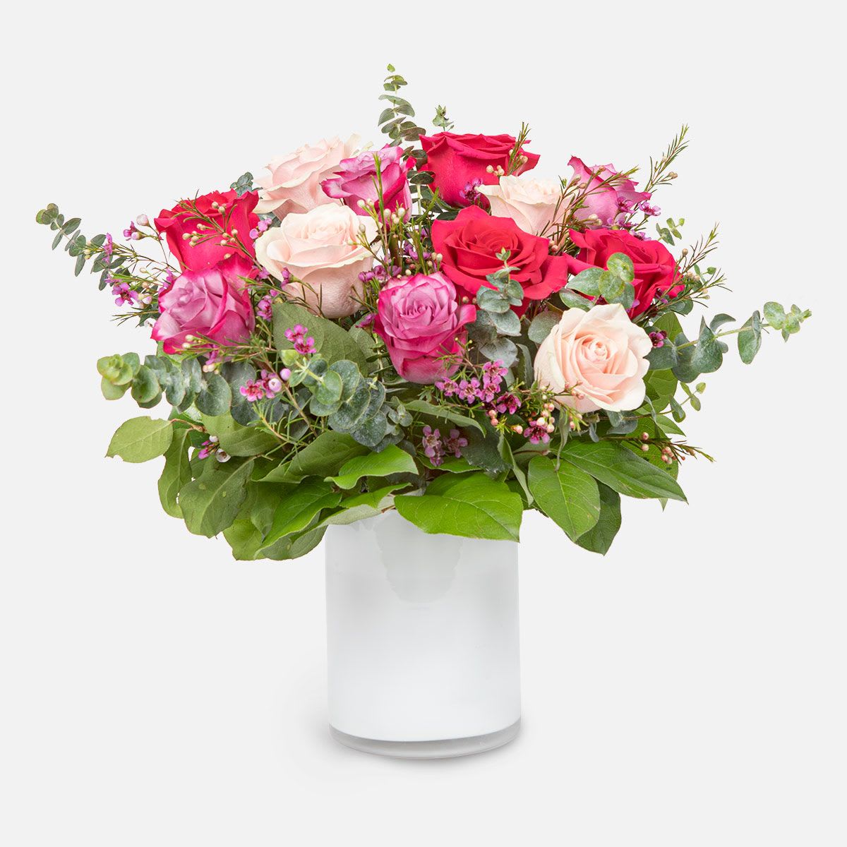Love Bug NYC - [ Height: 16’’ - 18’’ | Diameter: 13’’ - 14’’ ] Beautiful hues of pink roses, mixed with wax flowers and baby blue eucalyptus, make this elegant bouquet perfect for your Valentine. Beautifully arranged in a clear vase.  Celebrate any occasion by sending fresh flowers with PlantShed, hand-delivered to NYC + NJ.