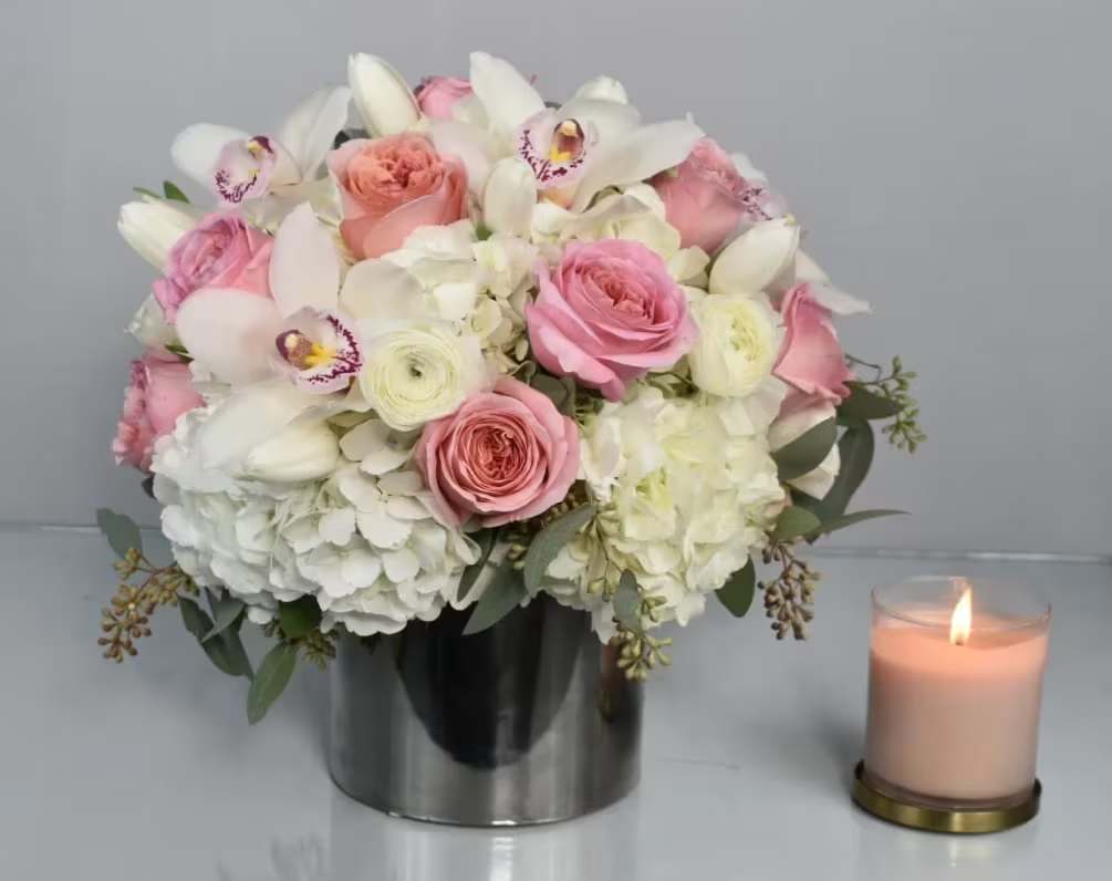 Sugar Baby Sugar Baby - This Sugar Baby design comes in a silver cylinder vase with white hydrangeas, light pink roses, white ranunculus, white tulips, white cymbidium orchids and a perfect touch of seeded eucalyptus. perfect for and office desk and perfect for any occasion Perfect for birthday flowers anniversary flower just because flowers congratulations flowers Get well flowers Christmas flowers Valentines Day flowers Mother's Day flowers