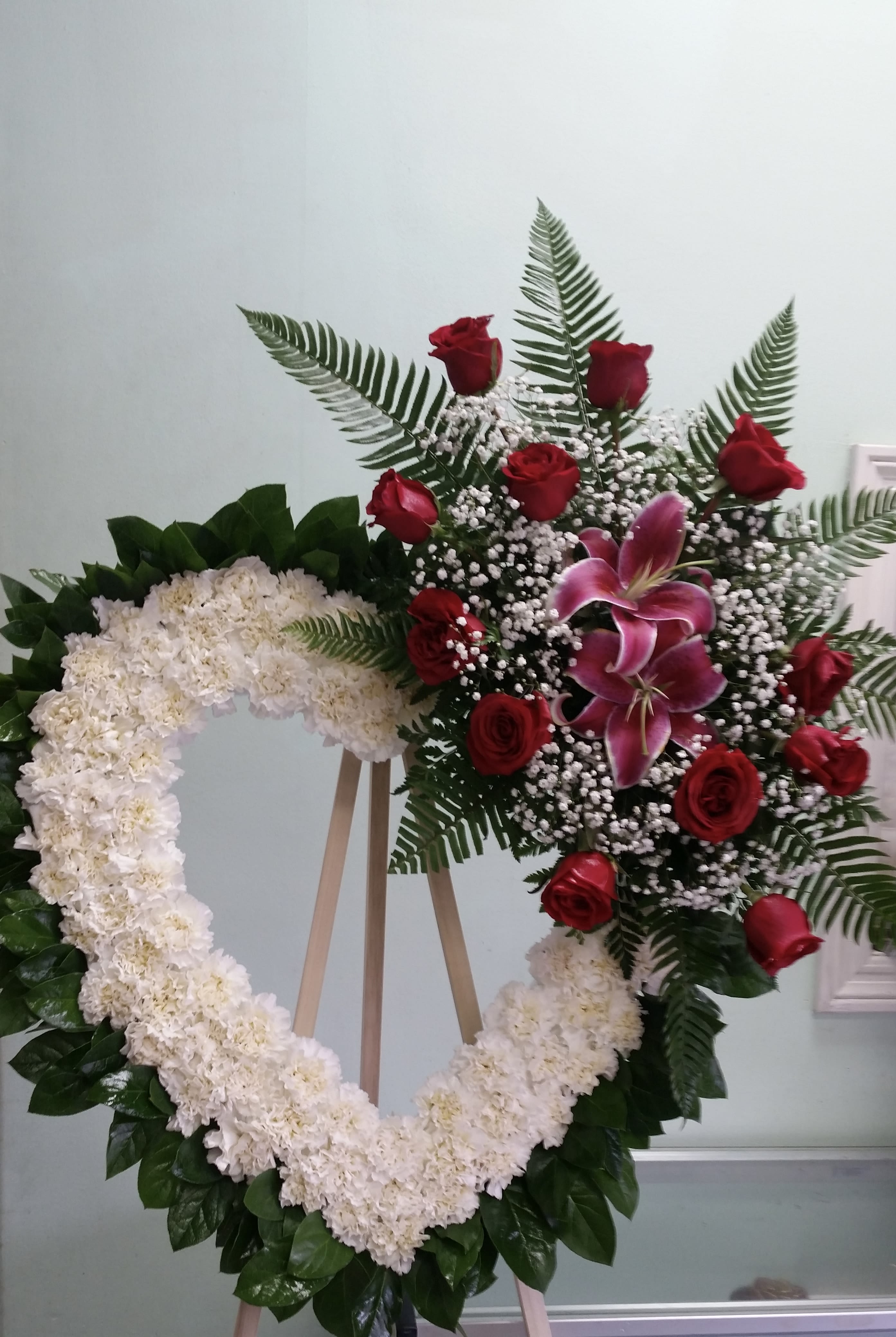 Heart of Tender Love Heart of Tender Love - Open heart with white carnations, red roses, and purple lilies.