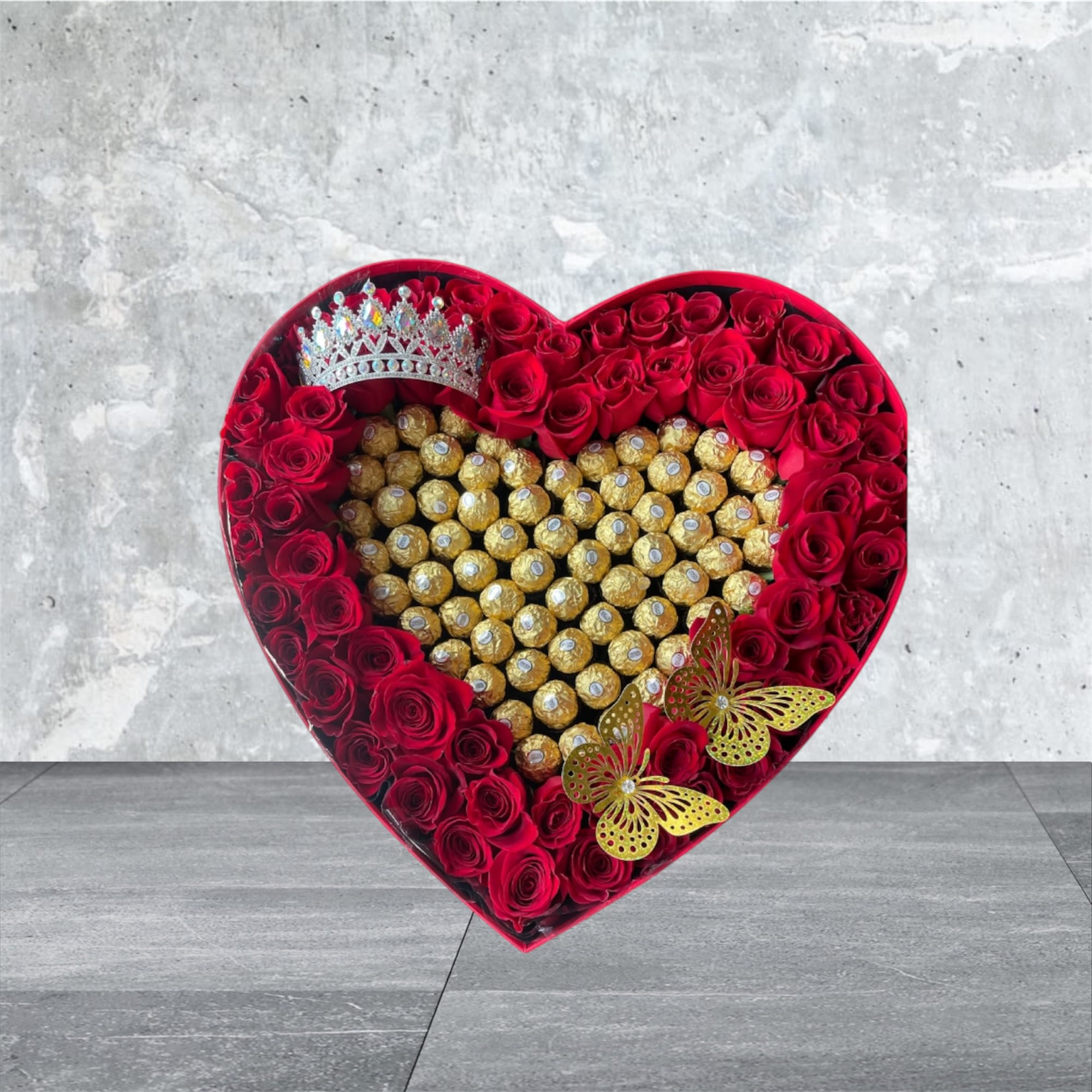 Large Heart Box with Chocolates - Picture is Deluxe Size **  This arrangement is an experience of the best of both worlds! You get box roses and chocolates in one arrangement!  Included: 3 Butterflies  Optional: Colors can be switched to Pink, Red or White