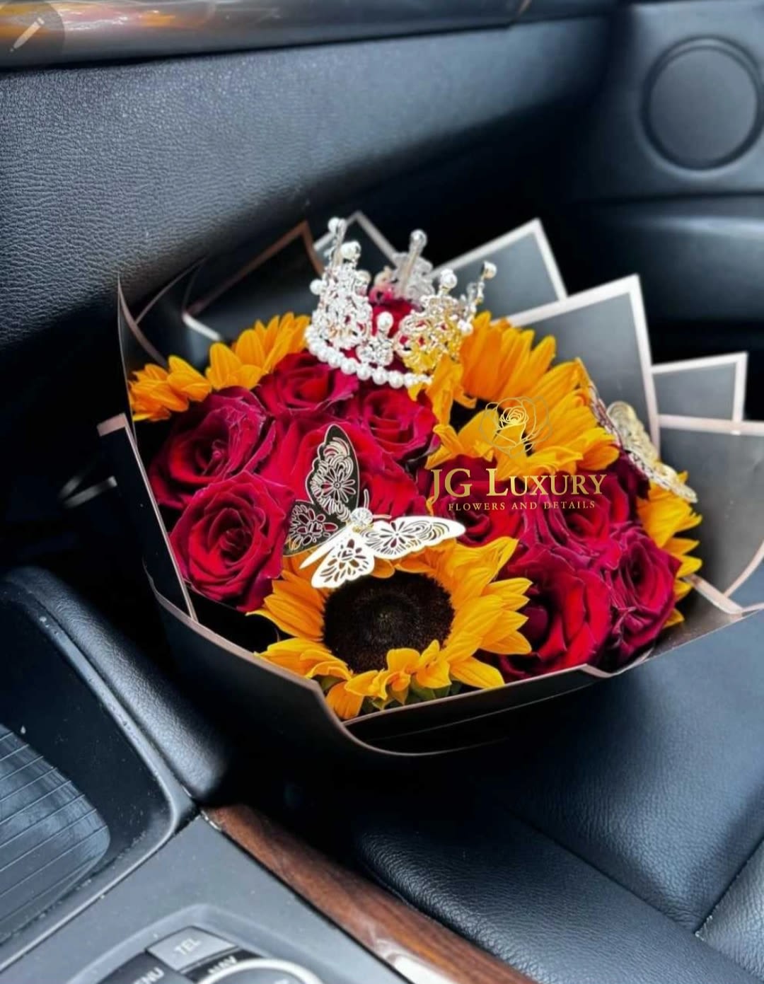 Queenie - Red roses with sunflowers, 2 butterflies and a crown.