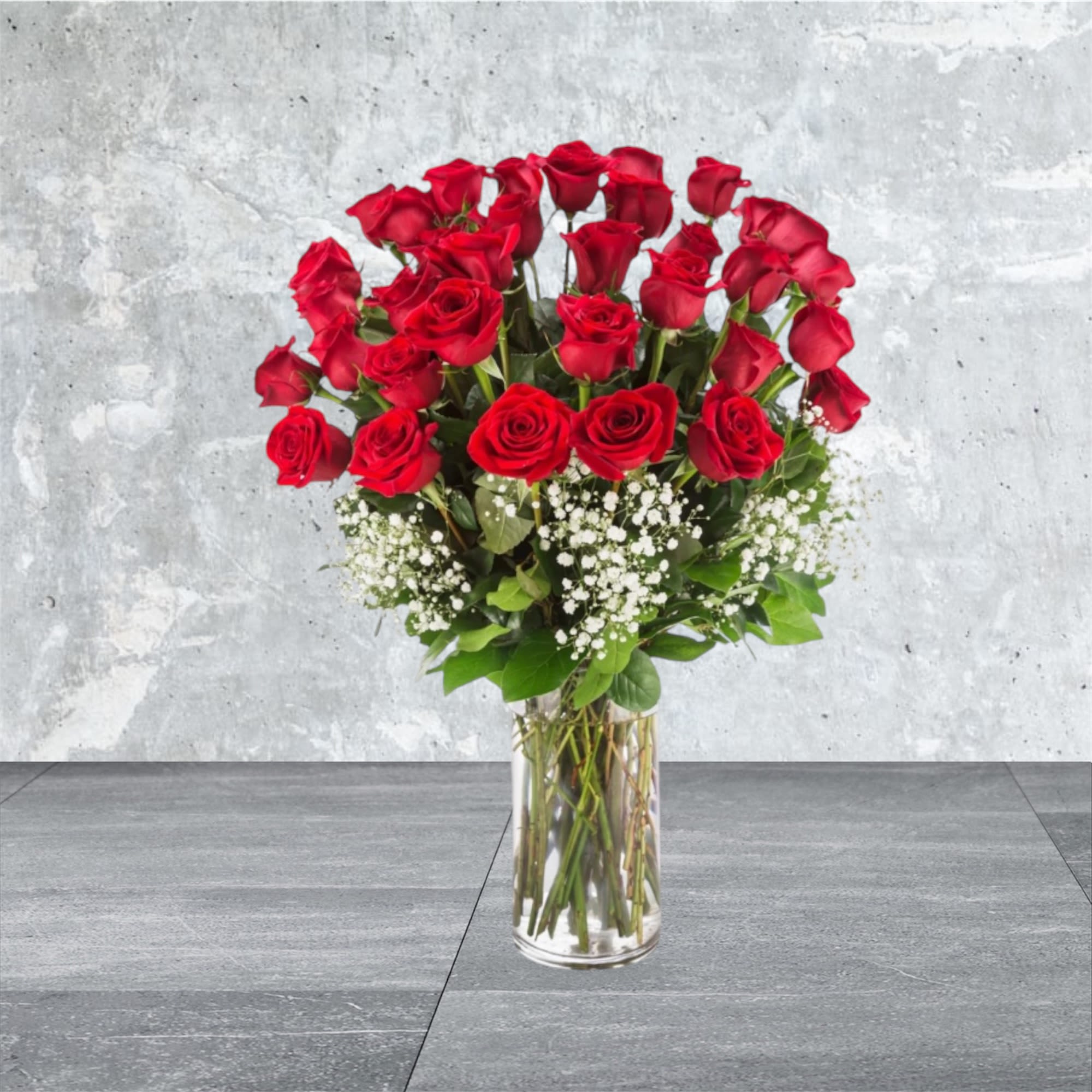 Grandeur Long Stem Rose Arrangement  - Go big with your love. Send the most extravagant 3 dozen red rose arrangement for Valentine's day, anniversary celebrations, or declarations of love. This luxury arrangement makes a big statement of &quot;I love you&quot; in 36 roses.  