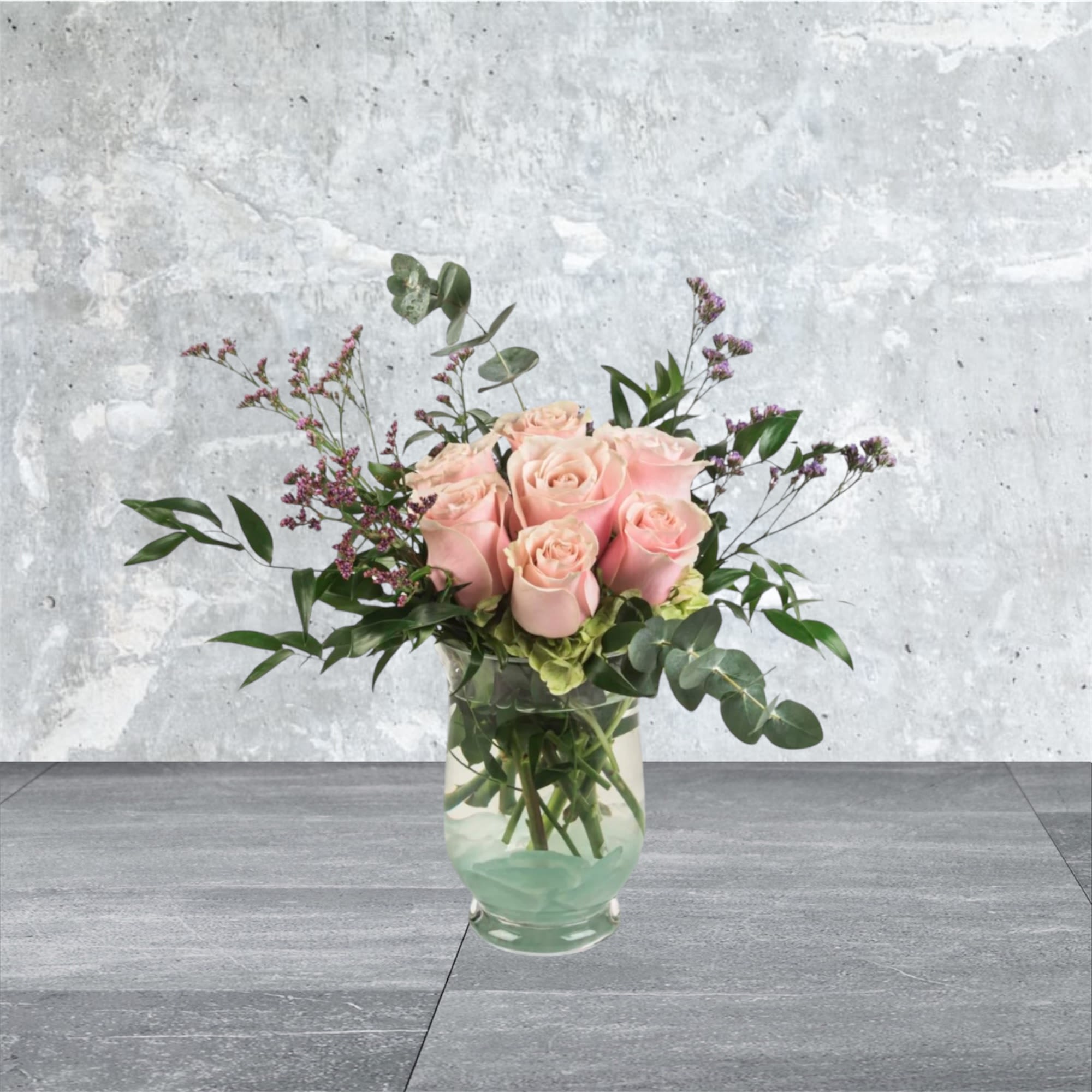 Daydreaming - Blush roses with a variety of greenery and eucalyptus come together for a lovely arrangement. A stylish and sweet way to dress up any space, send this arrangement for Mothers Day, Sister's Day, or Women's Day.   
