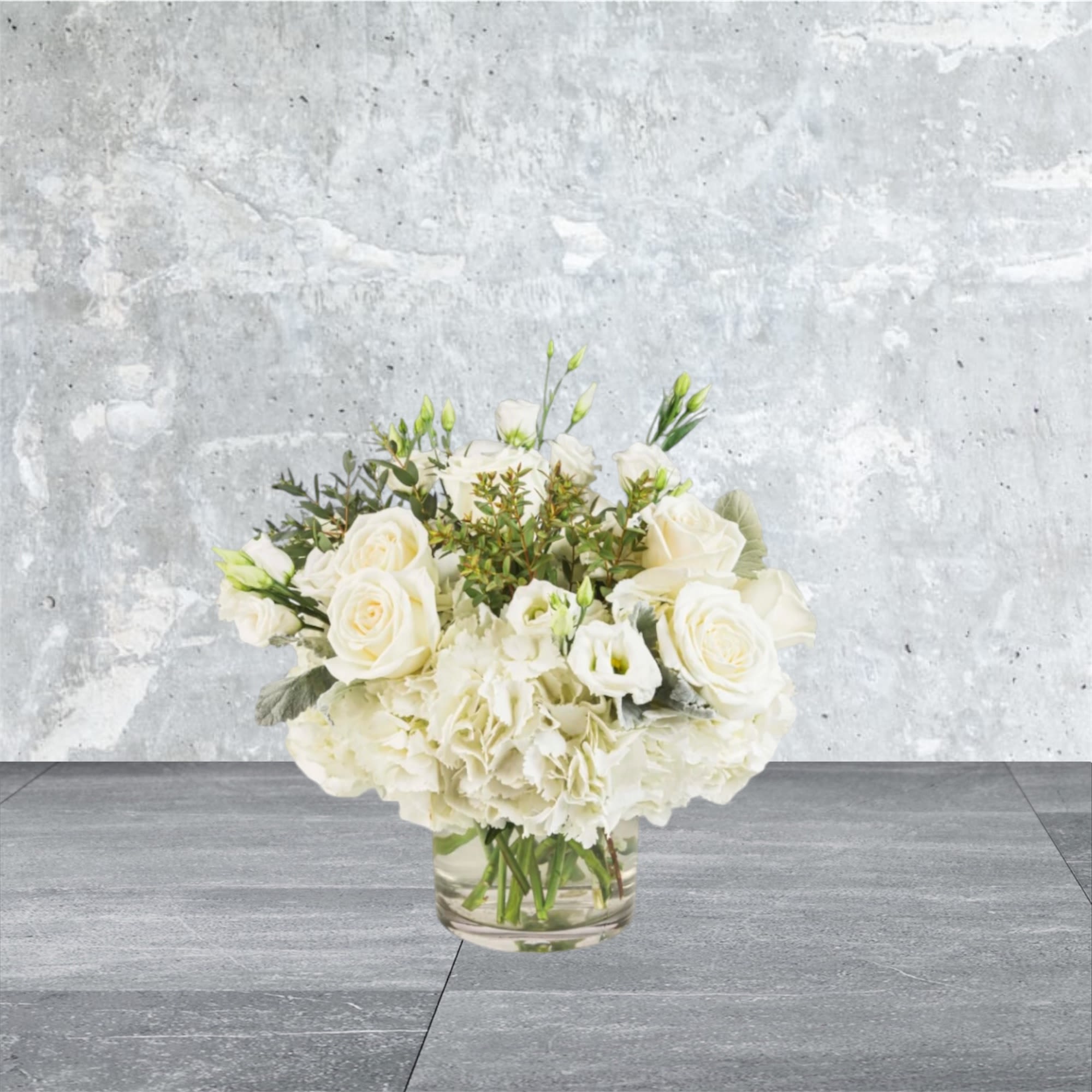Cloud Nine - New beginnings deserve flowers! This all white arrangement includes roses, lisianthus and hydrangeas. Cloud Nine by BloomNation™ is the perfect gift for celebrating a new year, a new baby, or a newly married couple.   APPROXIMATE DIMENSIONS 15&quot; W X 13&quot; H