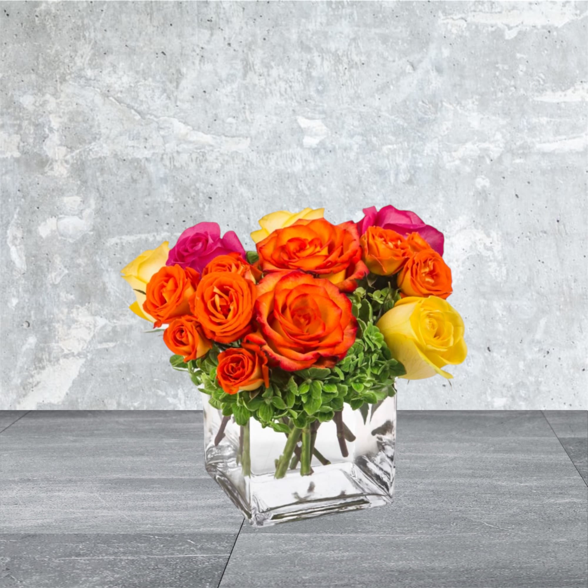 Bright Morning - Pink, yellow and orange roses come together with green hydrangea for a bright cube of sunshine. This arrangement lights up any space and will improve anybody's day. A perfect gift for all occasions.   APPROXIMATE DIMENSIONS 10&quot; W X 11&quot; H 
