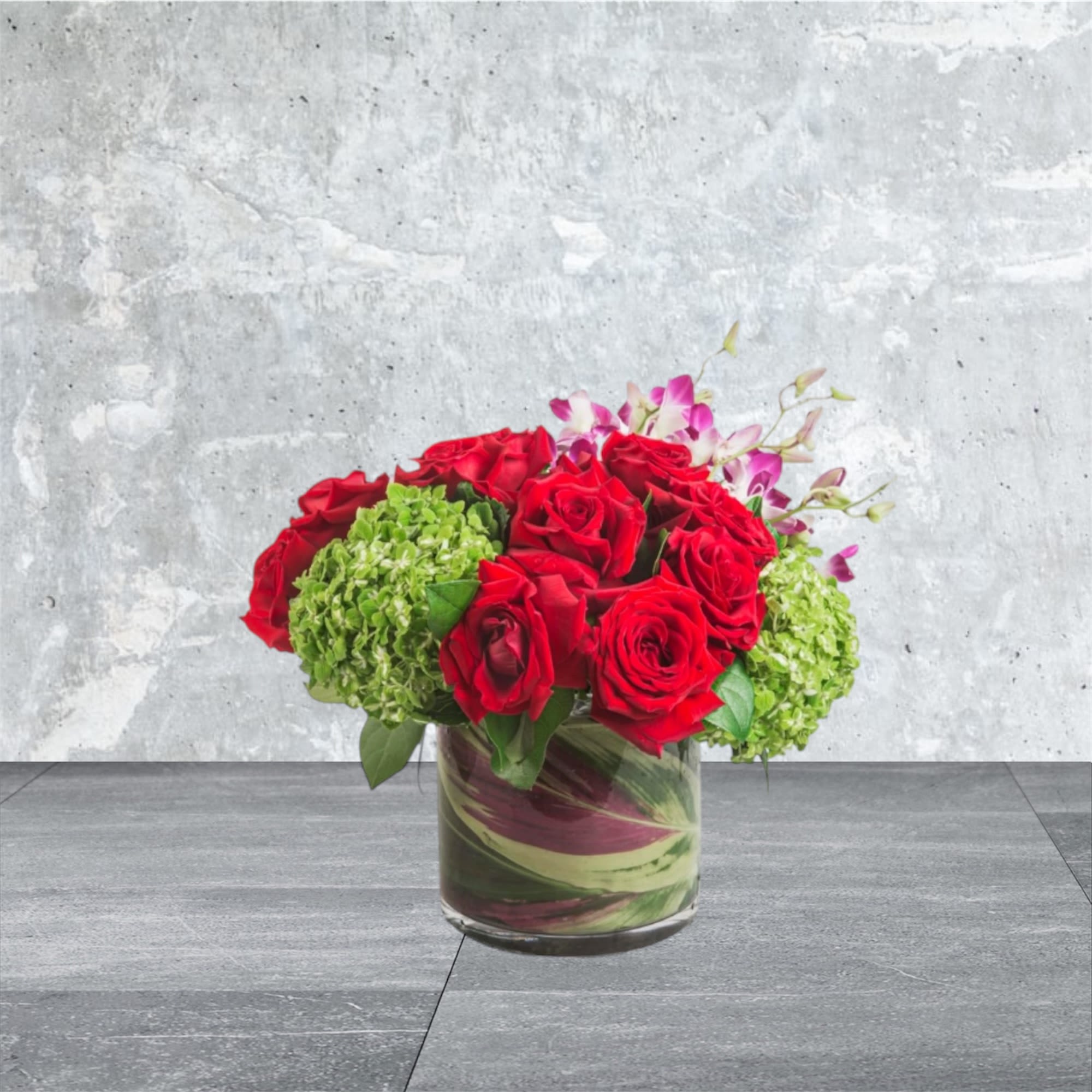 Bejeweled Nights by BloomNation™ - A celebration of luxury and life, this large and jewel toned arrangement is enough to stop anybody in their tracks. Roses, orchids and hydrangeas come together in this purely floral masterpiece.    APPROXIMATE DIMENSIONS are 12&quot;D X 12&quot;H