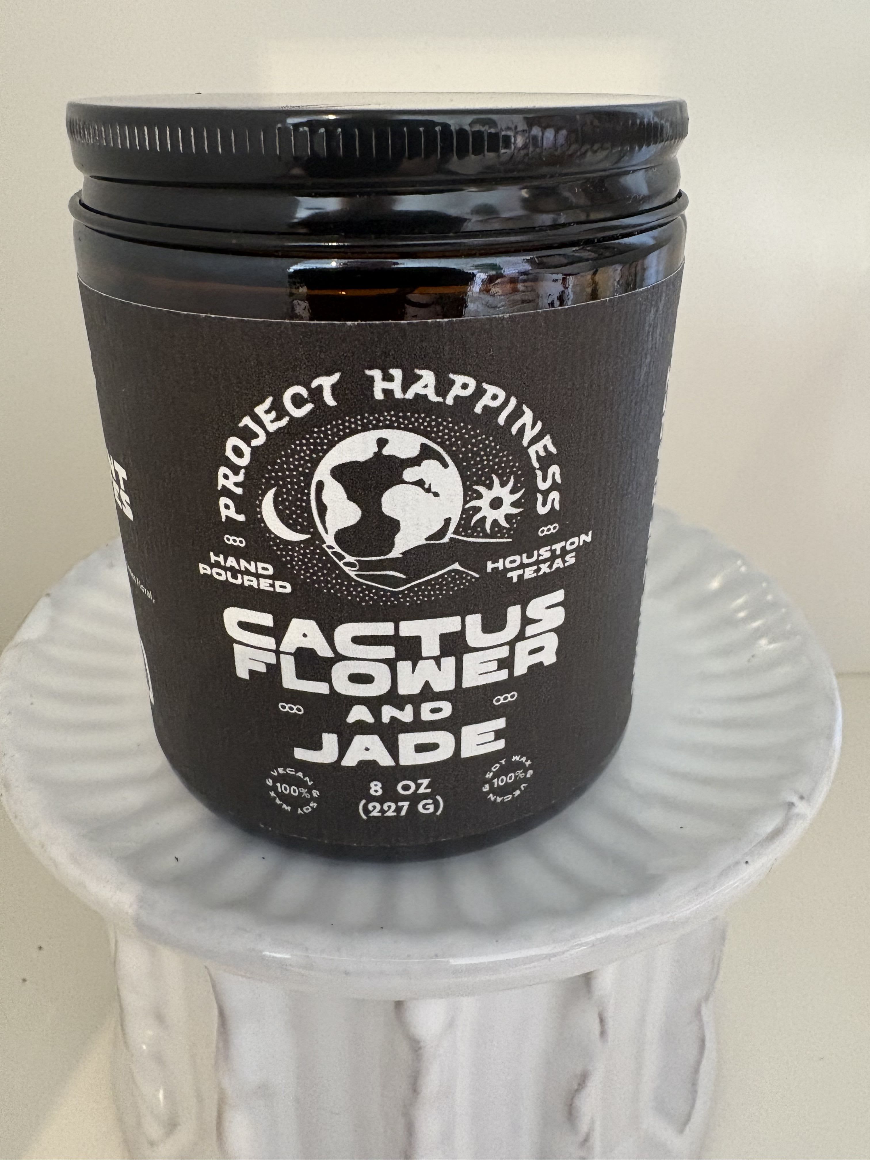 Cactus Flower &amp; Jade Candle  - Hand poured by Project Happiness.45 + hours of burn time. Scent notes, Agave, aloe, Green floral and patchouli. 100% soy wax. For every candle sold Project Happiness plants a tree. 