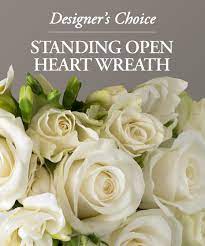 Designer's Choice - Open Heart Wreath Designer's Choice - Open Heart Wreath - Send a sympathy floral standing open heart wreath created by one of our floral experts. Seasonal flowers are arranged in this beautiful gift to show your care and concern; pastel roses, lilies, mums, snapdragons and more. You can get in pastel shades, bright and colorful, or in all white flowers. Standing sprays are an appropriate gift for delivery from a family member, friend or co-worker. Delivery is available directly to a funeral home or places of worship.