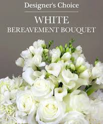 Designer's Choice Bereavement Vase Arrangement - All White Flowers  - Send a sympathy floral vase arrangement created by one of our floral experts. Seasonal flowers are arranged in this beautiful gift to show your care and concern; pastel roses, lilies, mums, snapdragons and more. You can get in pastel shades, bright and colorful, or in all white flowers. Standing sprays are an appropriate gift for delivery from a family member, friend or co-worker. Delivery is available directly to a funeral home or places of worship.