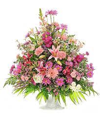 Traditional Funeral Basket - Pastel Colored Flowers Traditional Funeral Basket - Pastel Colored Flowers - Let their spirit light up the room. These pastel colored blooms are the perfect way to convey feelings of comfort and peace while sharing memories of fun-filled days.