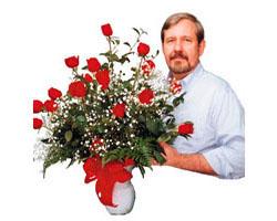 CUSTOM DESIGNED ROSES NEW-01 CUSTOM DESIGNED ROSES NEW-01 - Phone Dale Newton, owner, for all your special needs. 18 long stem premium roses pictured, artistically arranged in a large quality glass vase.