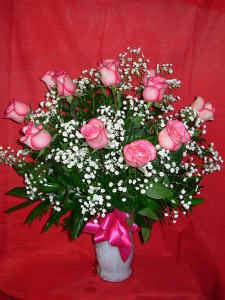 Dozen Carrousell Roses NEW-R06 Dozen Carrousell Roses NEW-R06 - ONE DOZEN PREMIUM, LONG STEM, CAROUSEL ROSES ARRANGED IN A QUALITY GLASS VASE WITH WHITE BABIES BREATH. THESE ARE A VERY LONG LASTING VARIETY OF PINK ROSES, WITH A VIBRANT HOT PINK EDGE TO THE PETALS.. FOR OTHER COLORS PLEASE PHONE US AT 1-800-331-5358 FOR ALL OF YOUR SPECIFIC ROSE NEEDS APPROX.. 26H X 22W